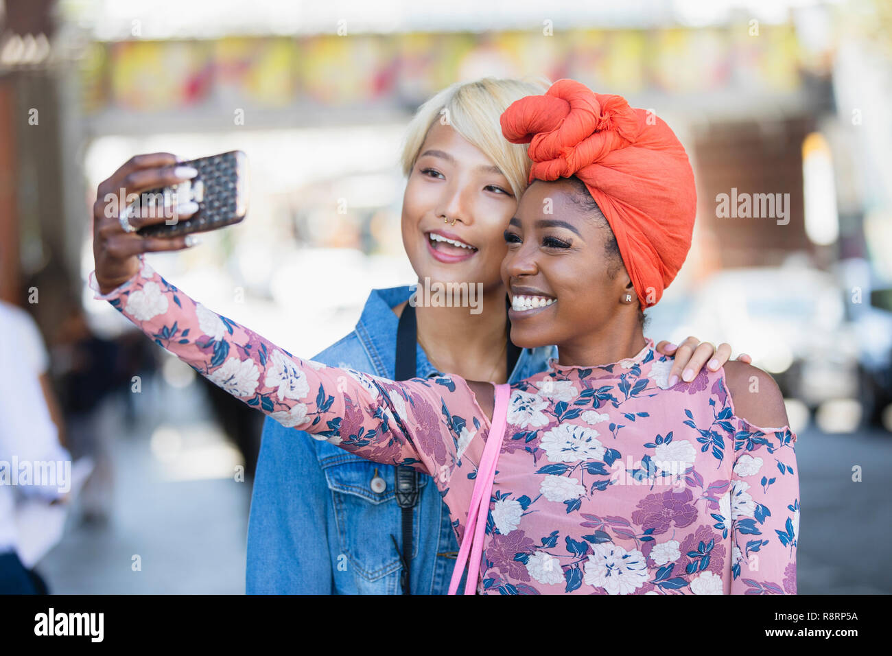 Happy young women taking selfie with camera phone Stock Photo