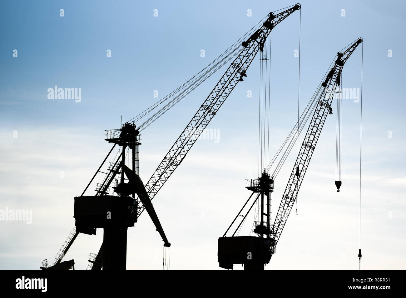 Harbor cranes against the sky Stock Photo - Alamy