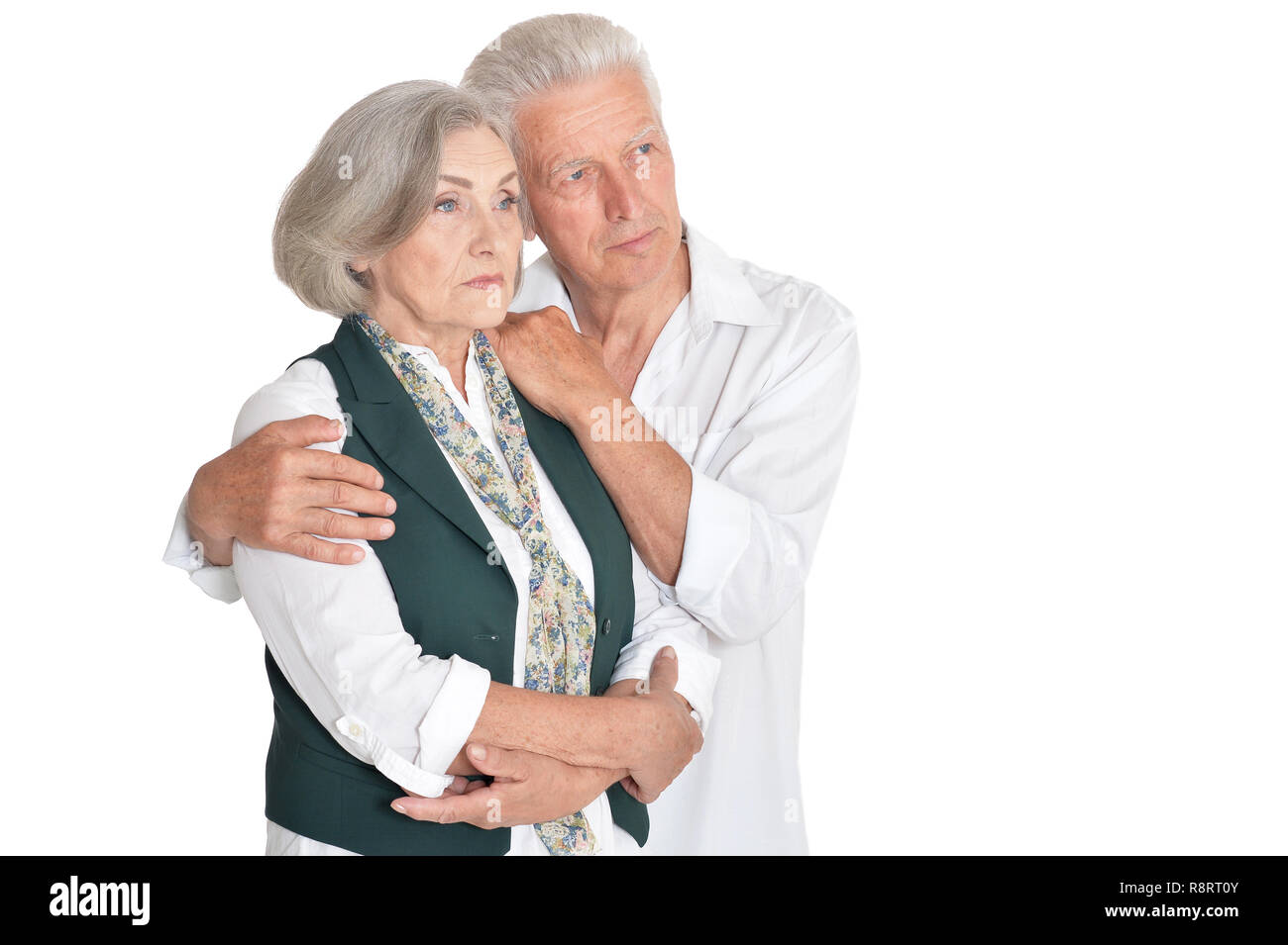 Portrait of thinking senior couple on white background Stock Photo