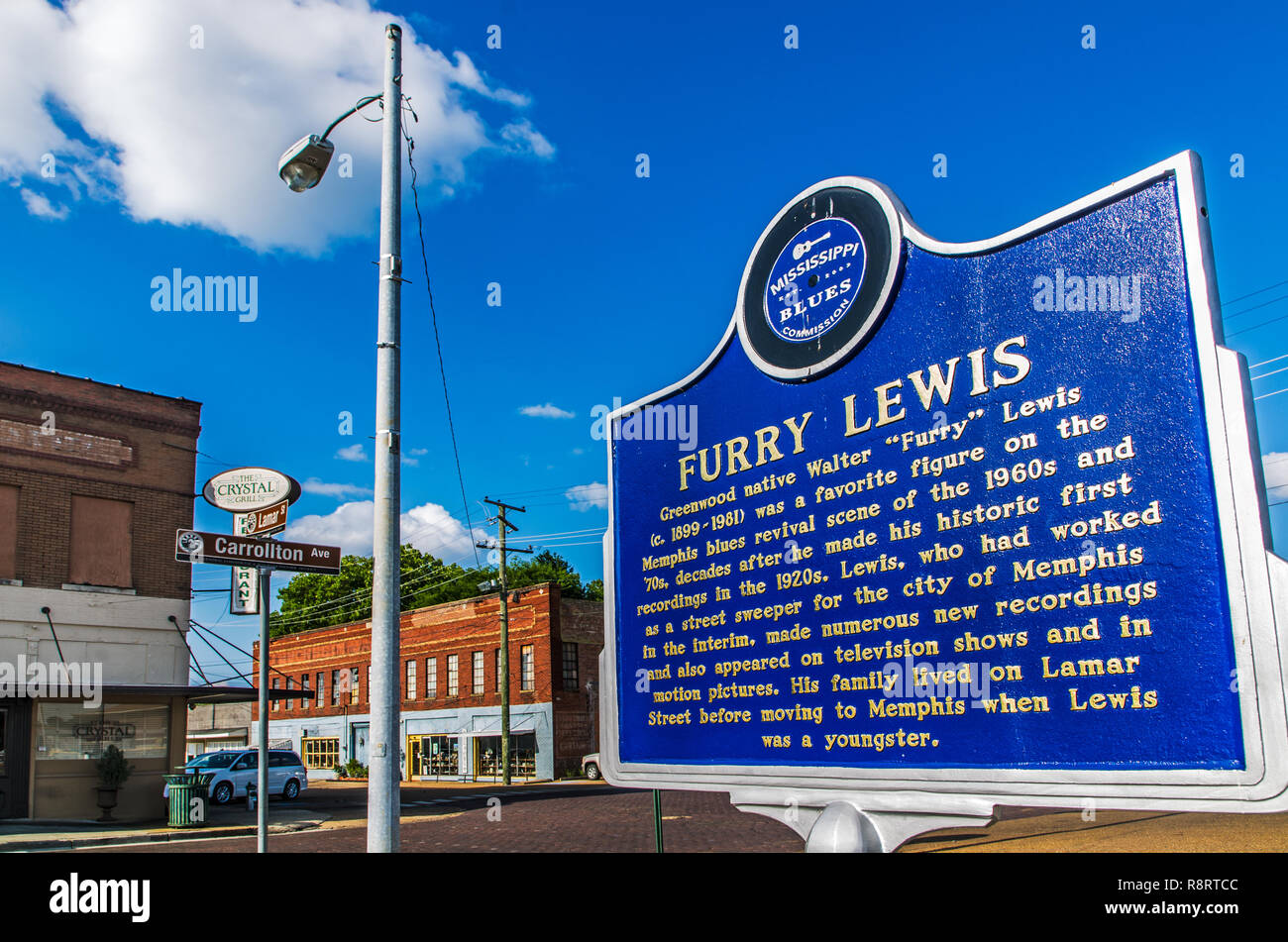 A historic marker erected by the Mississippi Blues Commission commemorates Greenwood native Furry Lewis. In the background is the Crystal Grill. Stock Photo