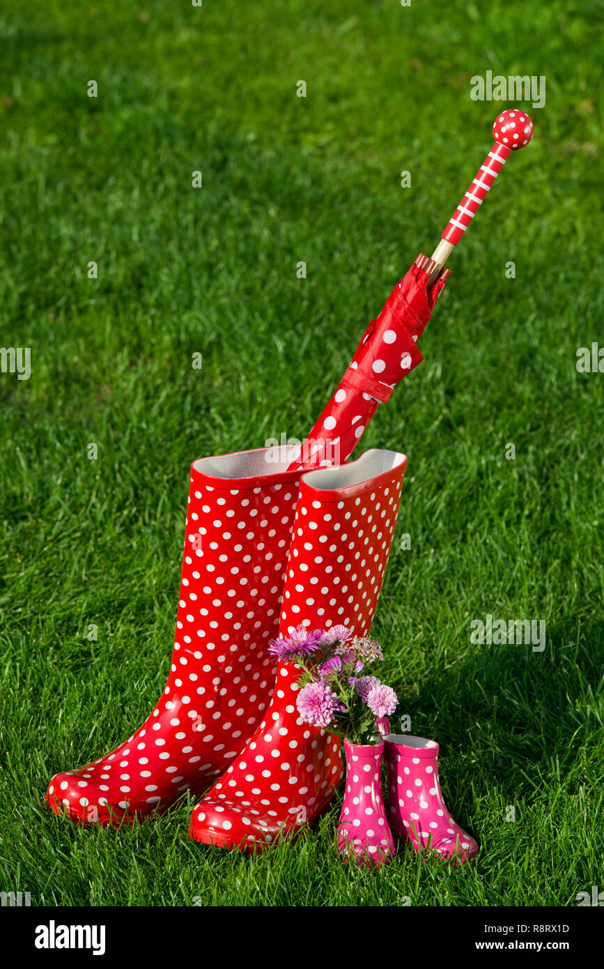 Rubber boots in a meadow Stock Photo - Alamy