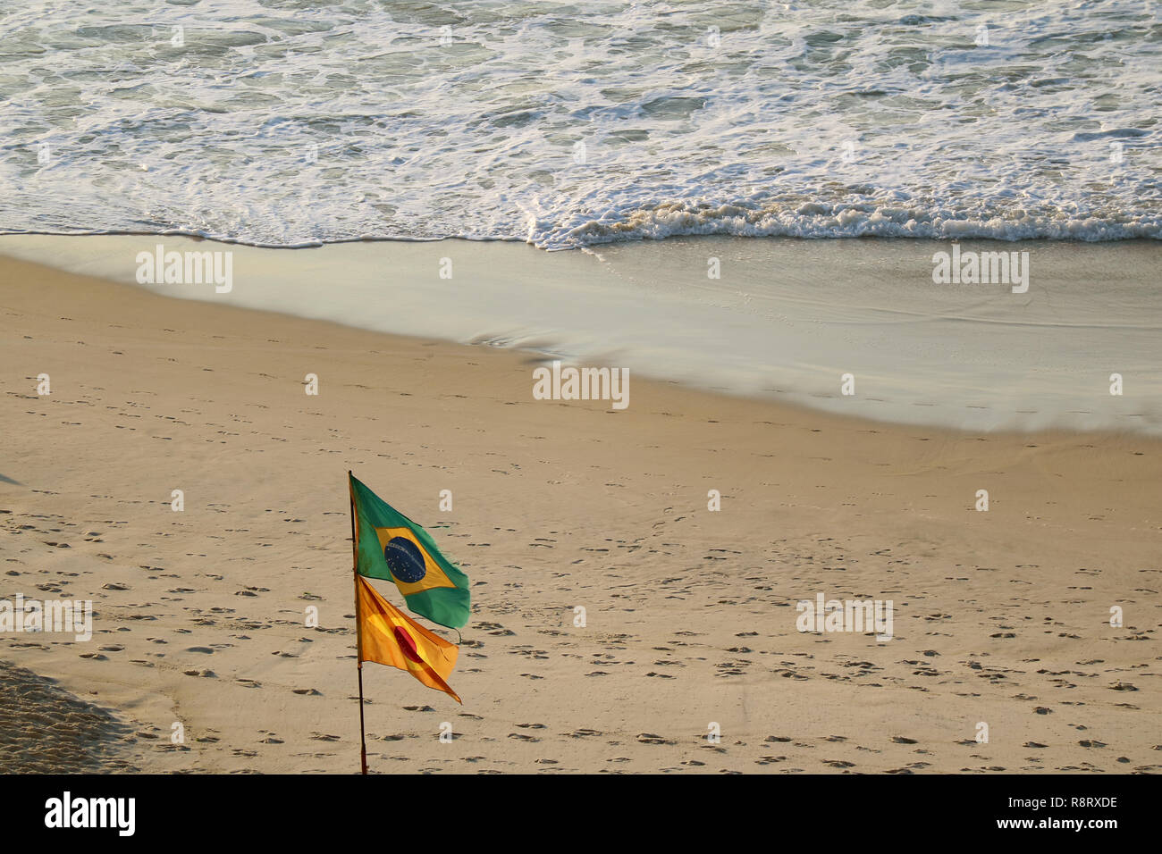 The flag of Brazil on Copacabana beach with powerful waves, Rio de Janeiro,  Brazil Stock Photo - Alamy