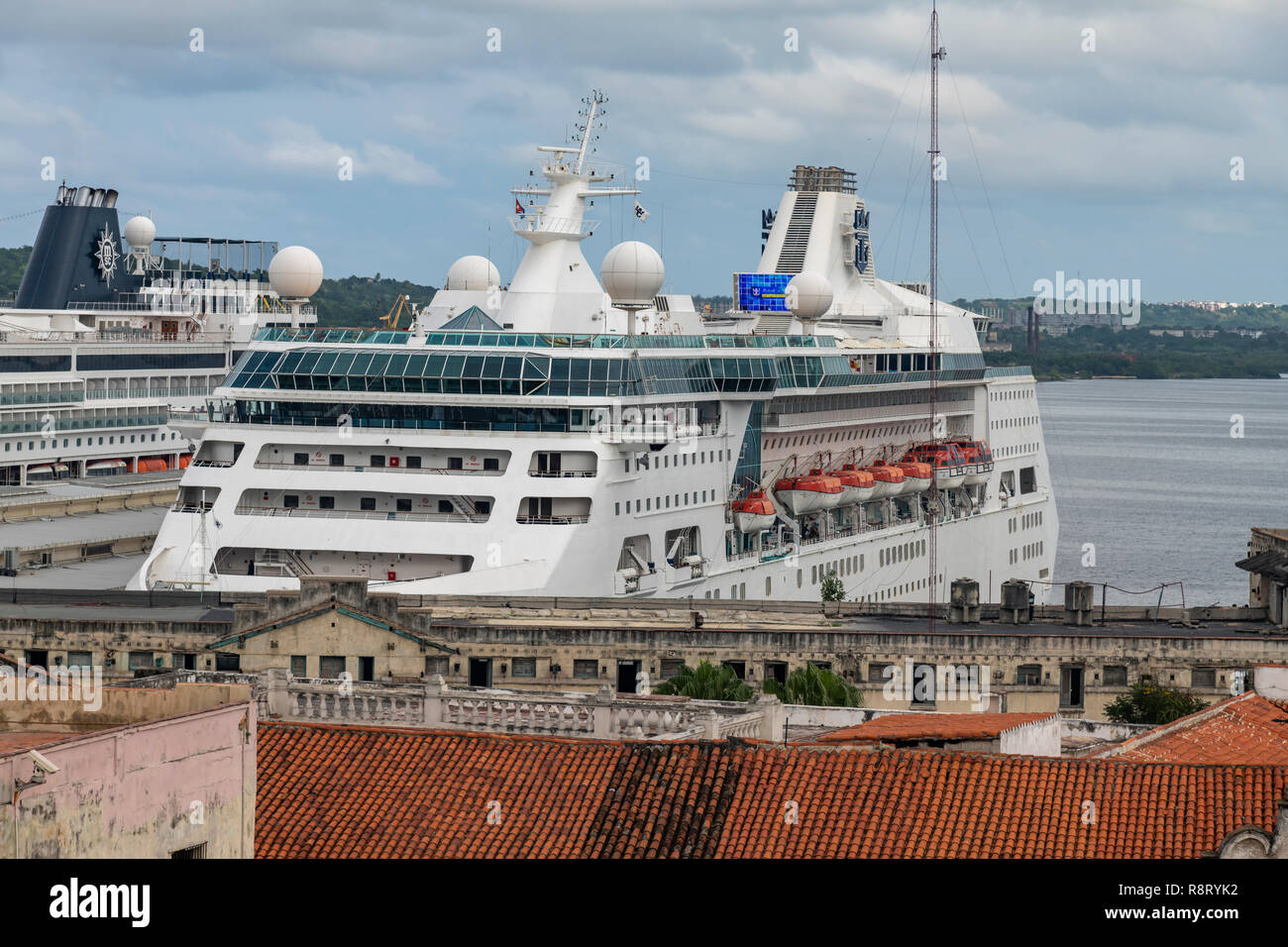 The huge cruise ship Empress of the Seas in Havana's tiny port, Terminal Cruceros. Shot from the roof of the Camera Obscura, Plaza Vieja. Cuba. Stock Photo