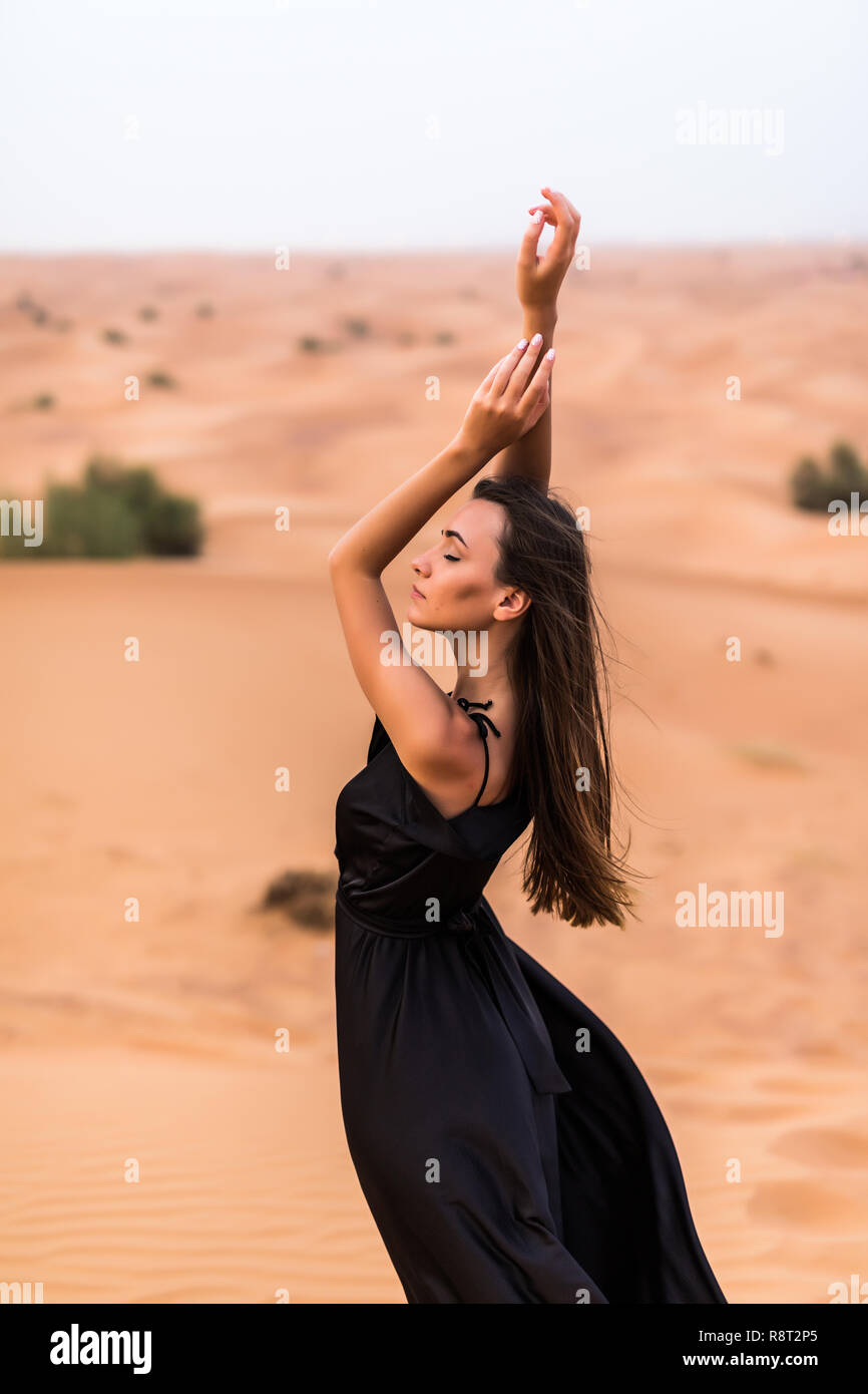 beautiful woman in black dress Memento Mini Swing Dress in Black 5X