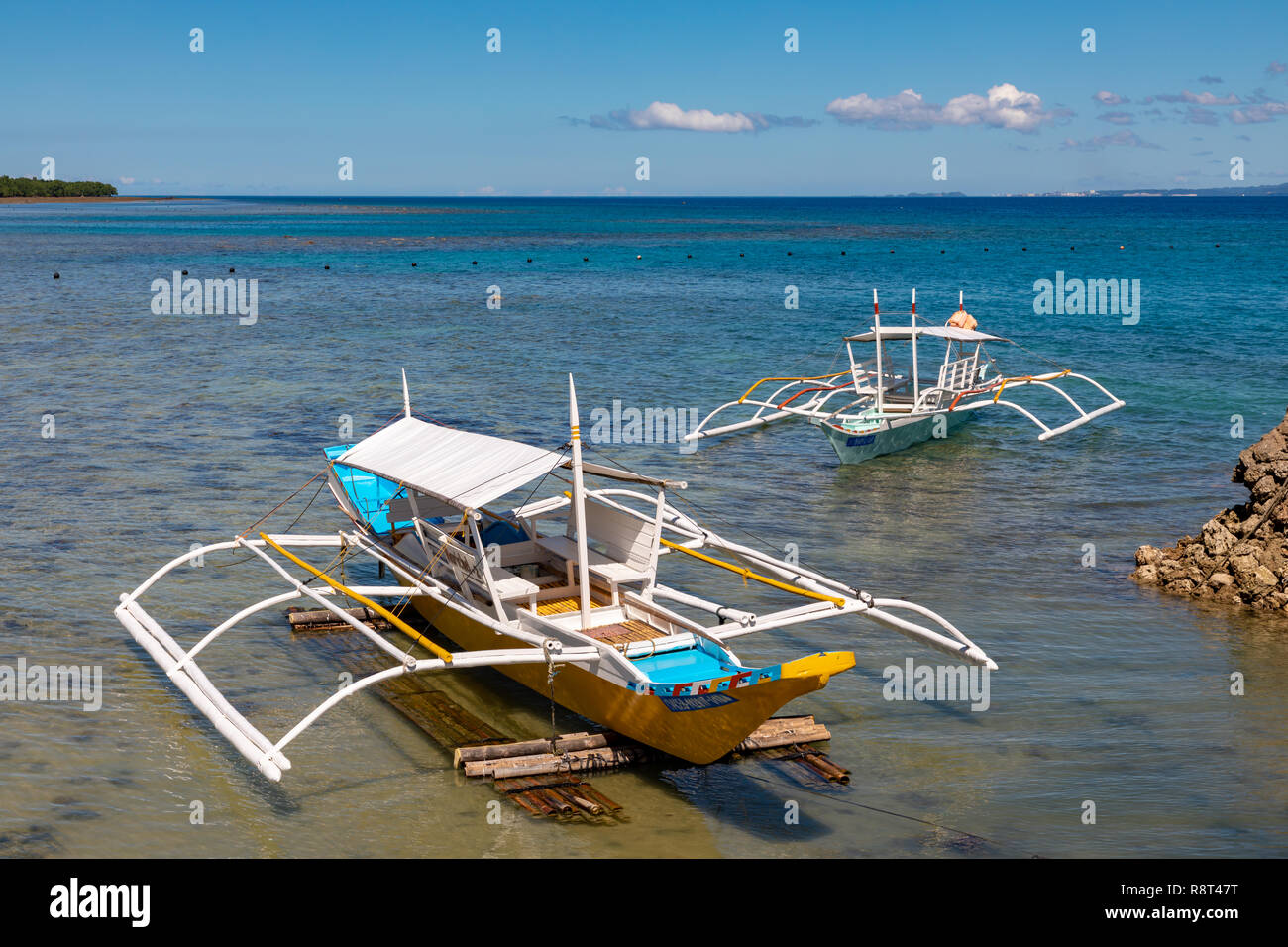 Asia, Philippines, Camotes Islands, Traditional outrigger boats at low