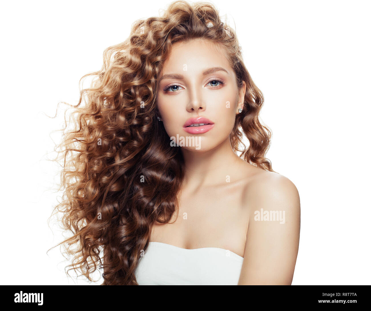 Young woman with healthy wavy hair and clear skin isolated on white Stock Photo