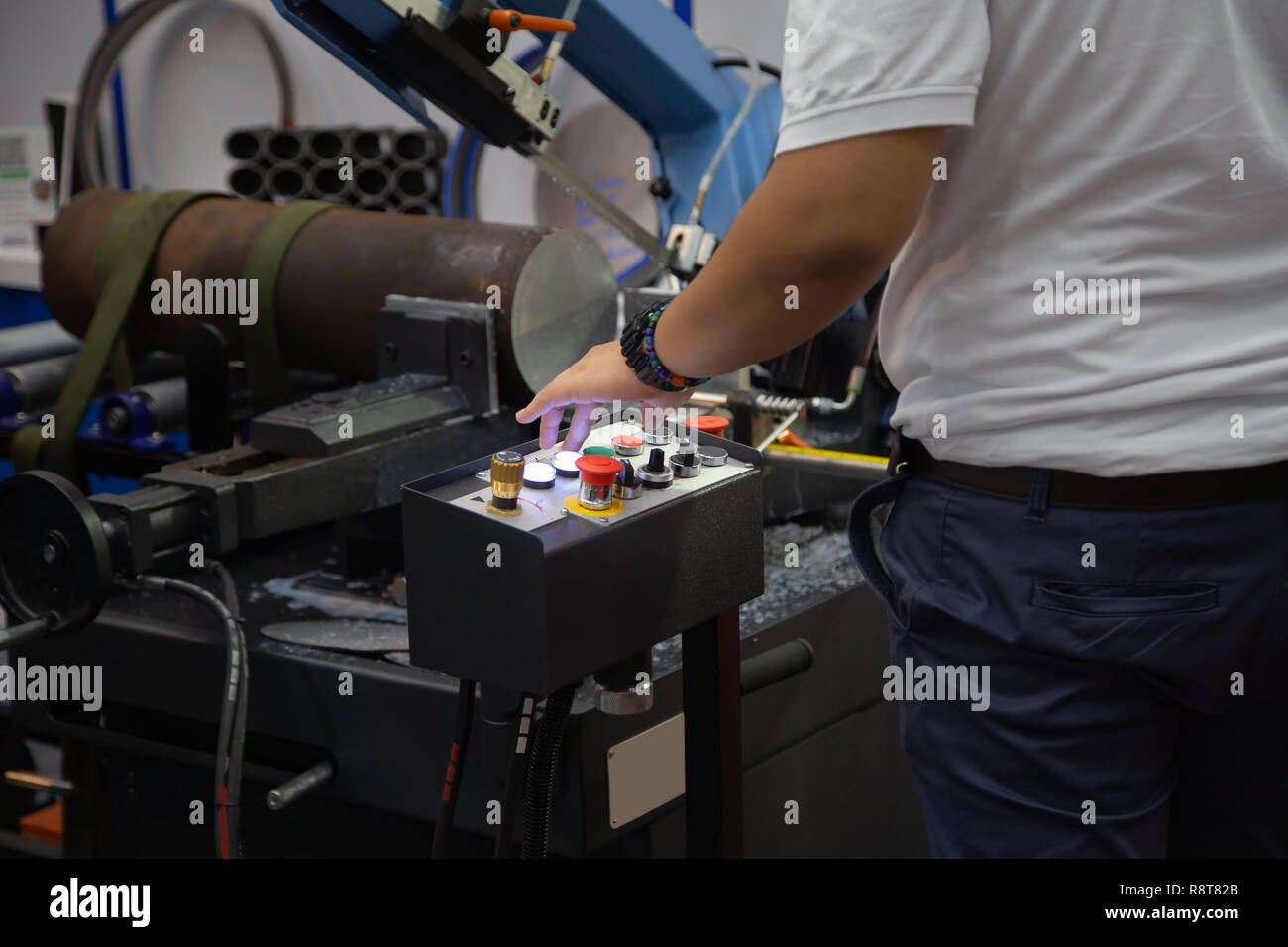 Worker operate band saw machine cutting metal workpiece Stock Photo Alamy