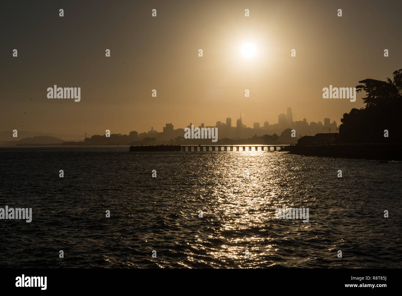 Torpedo Wharf and downtown silhouette at sunrise in San Francisco Stock Photo