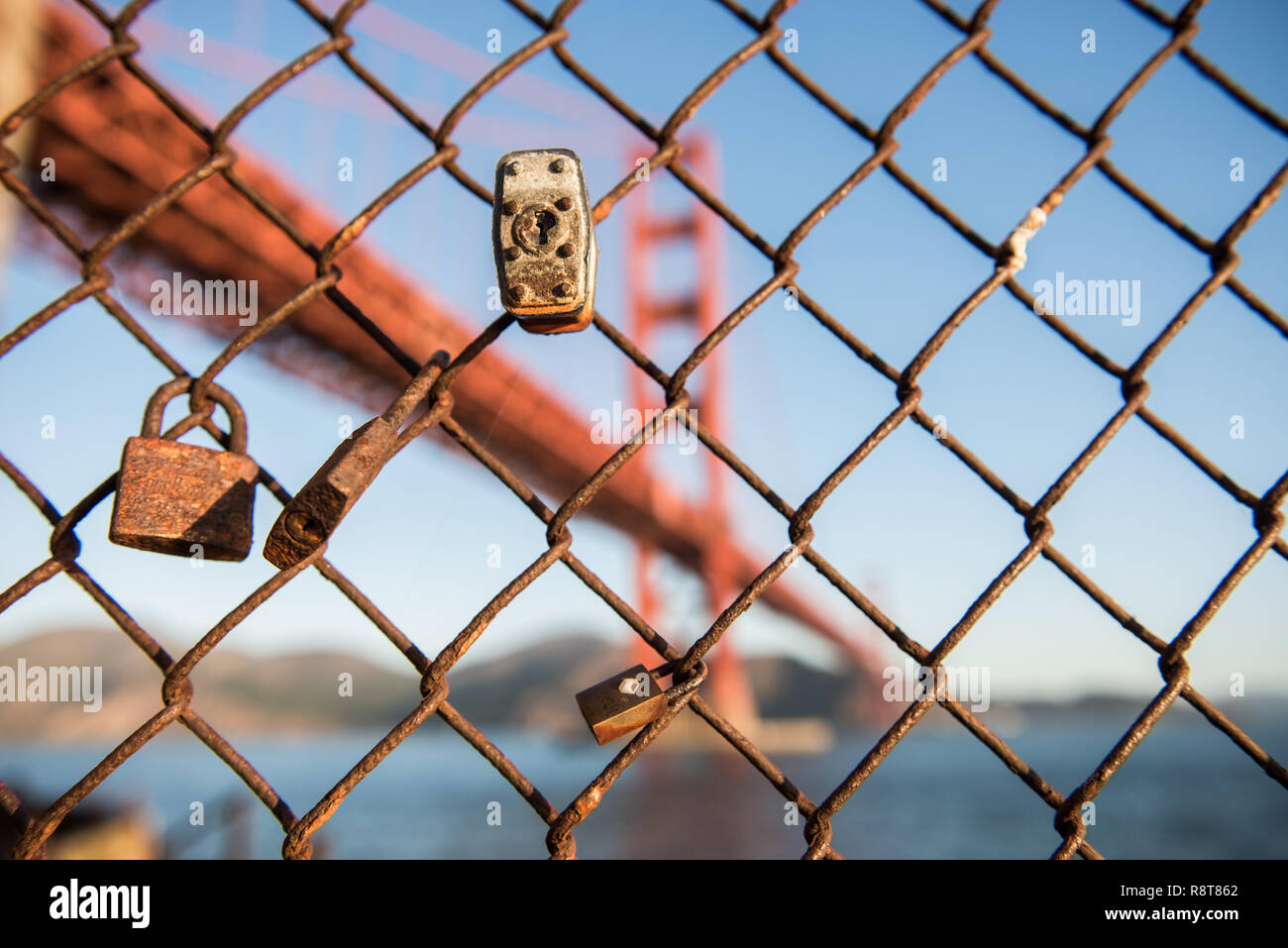 Padlocks and fence and the Golden Gate Bridge in the background at Fort