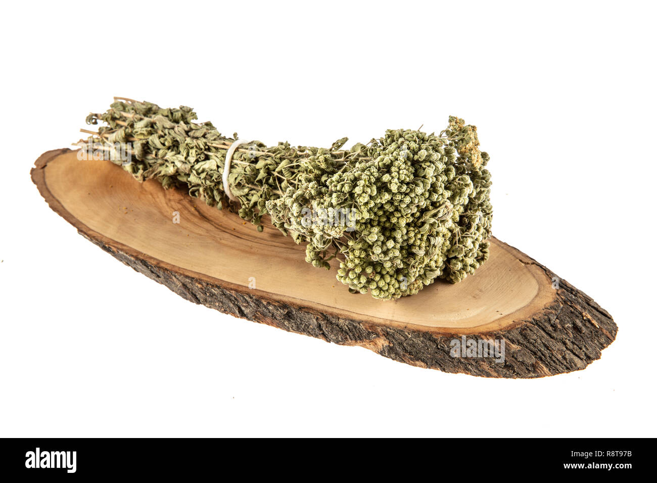 Dried thyme and bundle of thyme sprigs on white background Stock Photo