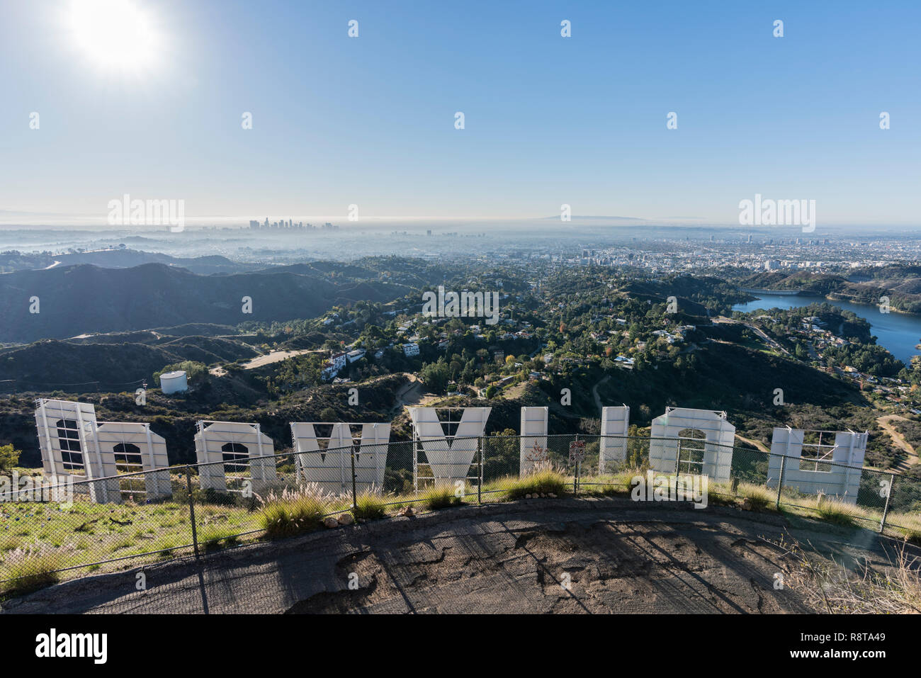 Los Angeles, California, USA - December 13, 2018:  Sunny morning cityscape view from behind the Hollywood sign in popular Griffith Park. Stock Photo