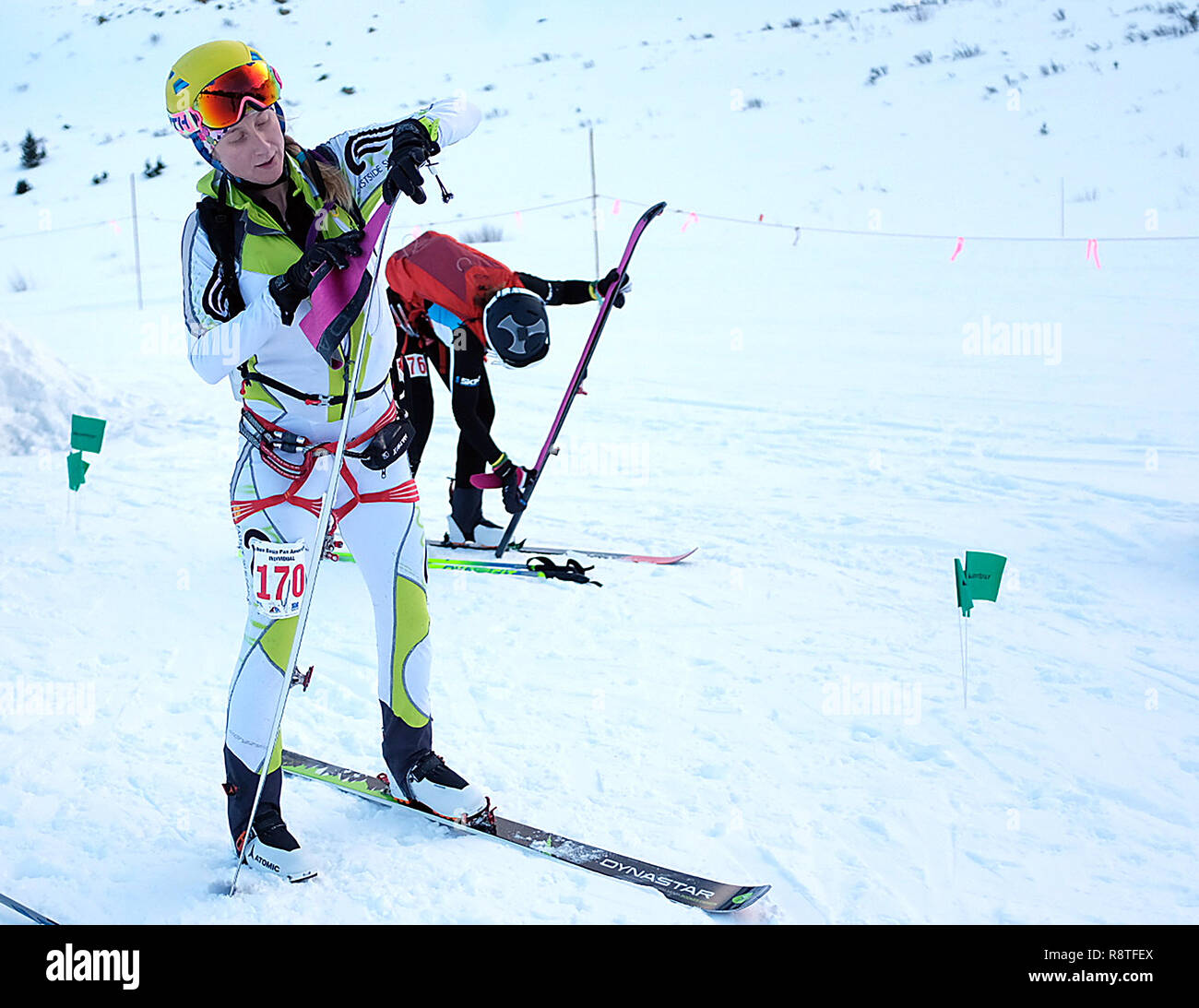 December 15, 2018: Women's ski mountaineering racer, Michela Adrian #130, applies climbing skins to her skis during the difficult United States Ski Mountaineering Association's Individual Race. Arapahoe Basin Ski Area, Dillon, Colorado. Stock Photo