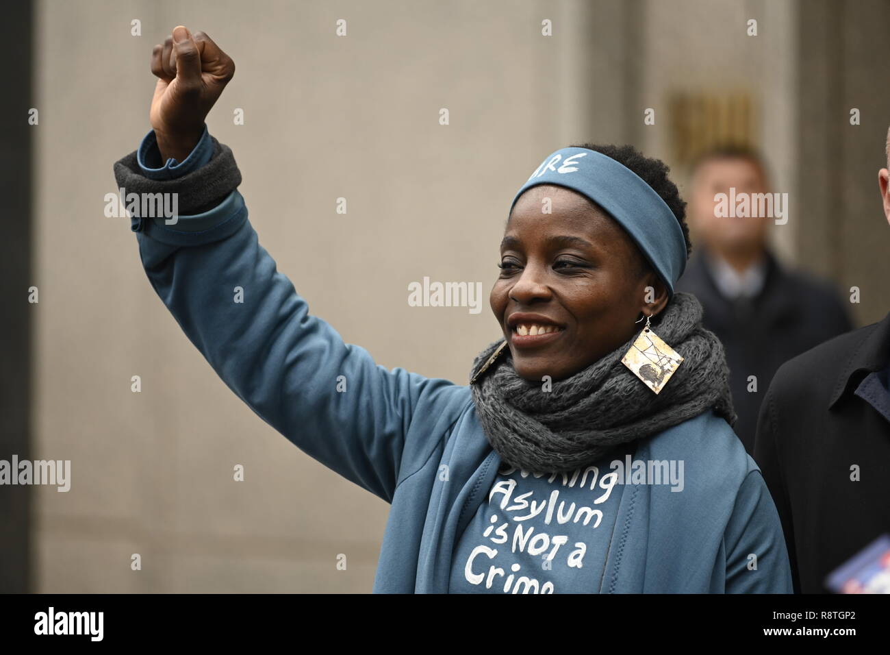 New York, USA. 17th Dec, 2018. New York, U.S., 17 December 2018 Statue of Liberty climber Patricia Okoumou salutes supporters outside federal court following her conviction by a federal magistrate judge on misdemeanor charges of trespassing, disorderly conduct, and interfering with the functioning of government for her act of civil disobedience on July 4. Okoumou climbed the base of the statue to protest against Trump administration immigration policies. She is to be sentenced on March 5, 2019. Credit: Joseph Reid/Alamy Live News Stock Photo