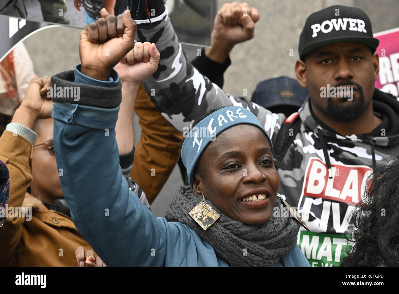 New York, USA. 17th Dec, 2018. New York, U.S., 17 December 2018 Statue of Liberty climber Patricia Okoumou and supporters raise their fists outside federal court following her conviction by a federal magistrate judge on misdemeanor charges of trespassing, disorderly conduct, and interfering with the functioning of government for her act of civil disobedience on July 4. Okoumou climbed the base of the statue to protest against Trump administration immigration policies. She is to be sentenced on March 5, 2019. Credit: Joseph Reid/Alamy Live News Stock Photo