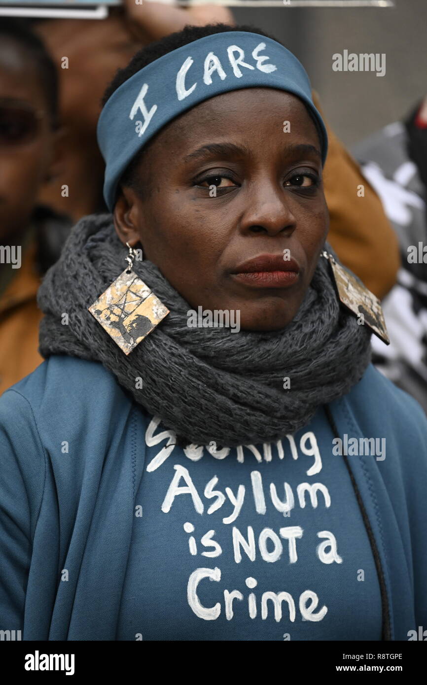 New York, USA. 17th Dec, 2018. New York, U.S., 17 December 2018 Statue of Liberty climber Patricia Okoumou listens as supporters speak outside federal court following her conviction by a federal magistrate judge on misdemeanor charges of trespassing, disorderly conduct, and interfering with the functioning of government for her act of civil disobedience on July 4. Okoumou climbed the base of the statue to protest against Trump administration immigration policies. She is to be sentenced on March 5, 2019. Credit: Joseph Reid/Alamy Live News Stock Photo