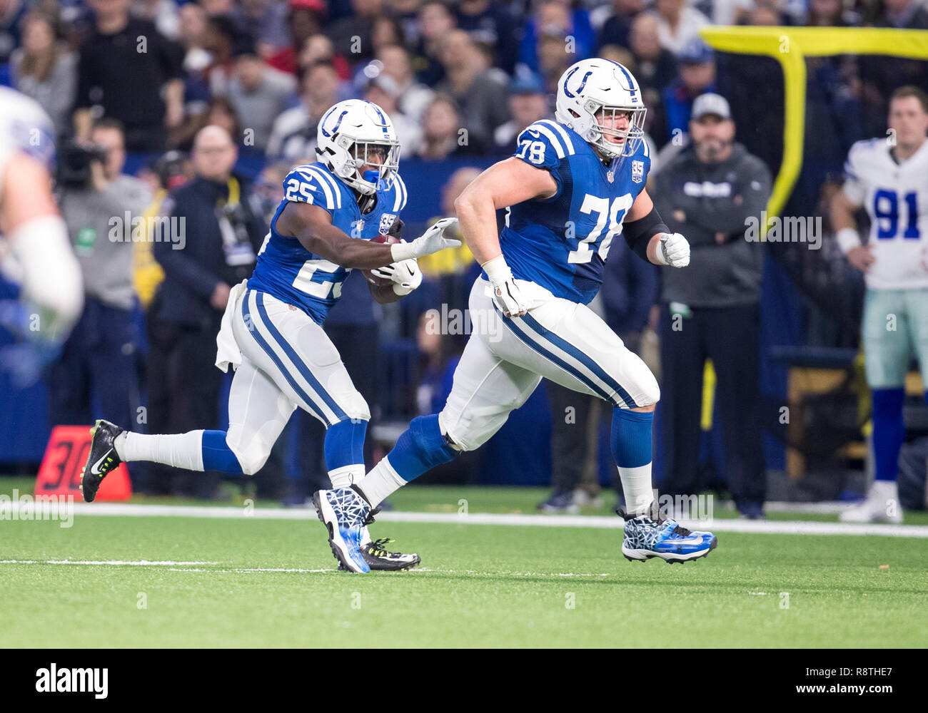 Indianapolis, Indiana, USA. 16th Dec, 2018. Indianapolis Colts center Ryan Kelly (78) lead blocks for Indianapolis Colts running back Marlon Mack (25) during NFL football game action between the Dallas Cowboys and the Indianapolis Colts at Lucas Oil Stadium in Indianapolis, Indiana. Indianapolis defeated Dallas 23-0. John Mersits/CSM/Alamy Live News Stock Photo