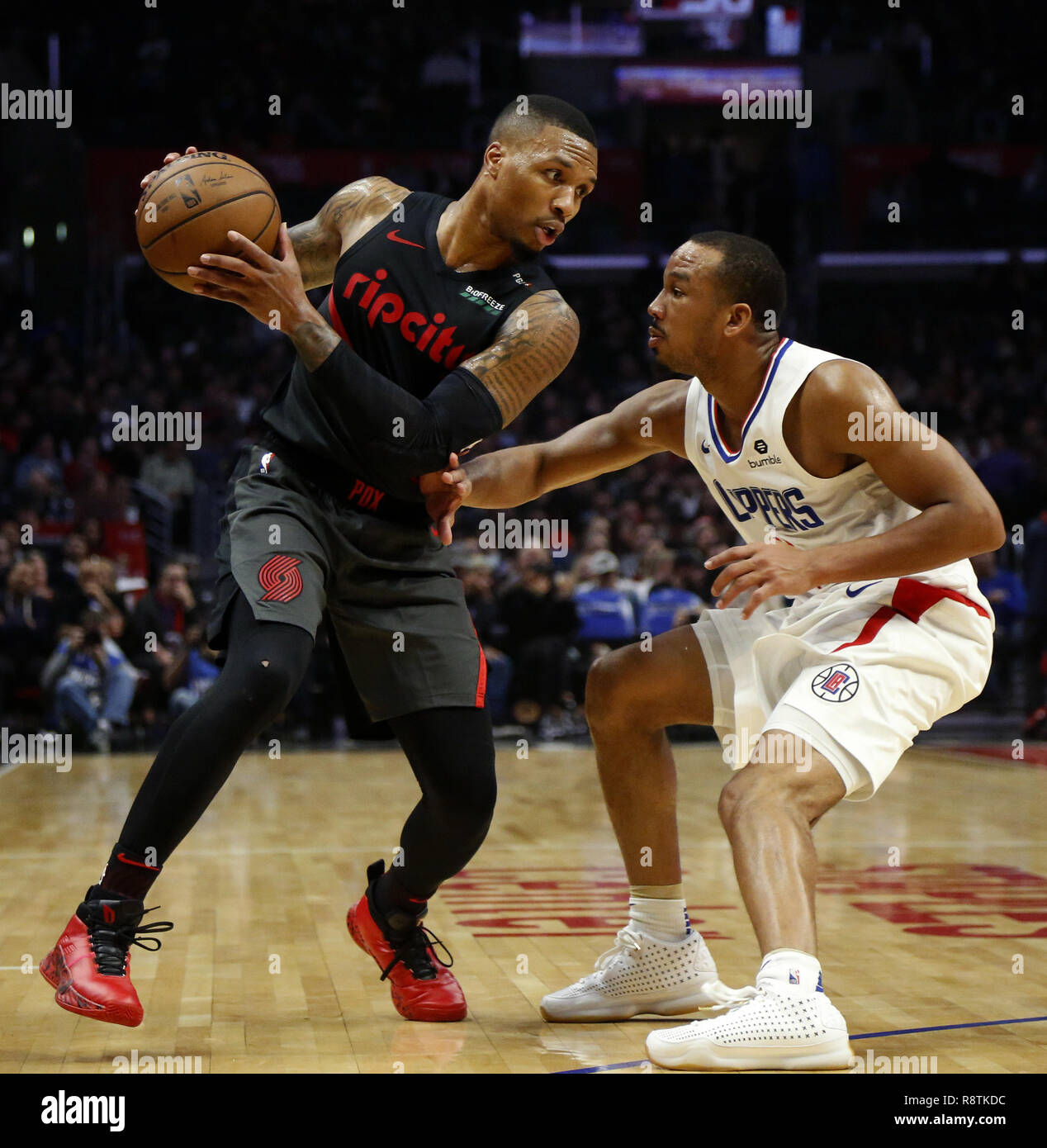 Los Angeles, California, USA. 17th Dec, 2018. Portland Trail Blazers'  Damian Lillard (0) is defended by Los Angeles Clippers' Avery Bradley (11)  in an NBA basketball game between Los Angeles Clippers and