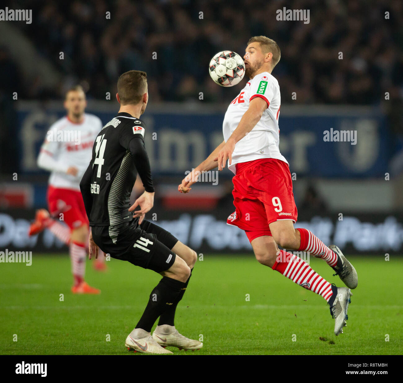 Cologne, Germany 17th December 2018, 2nd League, 1. FC Koeln vs 1. FC Magdeburg: Steffen Schaefer (Magdeburg), Simon Terodde (Koeln) in competition.   DFL REGULATIONS PROHIBIT ANY USE OF PHOTOGRAPHS AS IMAGE SEQUENCES AND/OR QUASI-VIDEO             Credit: Juergen Schwarz/Alamy Live News Stock Photo
