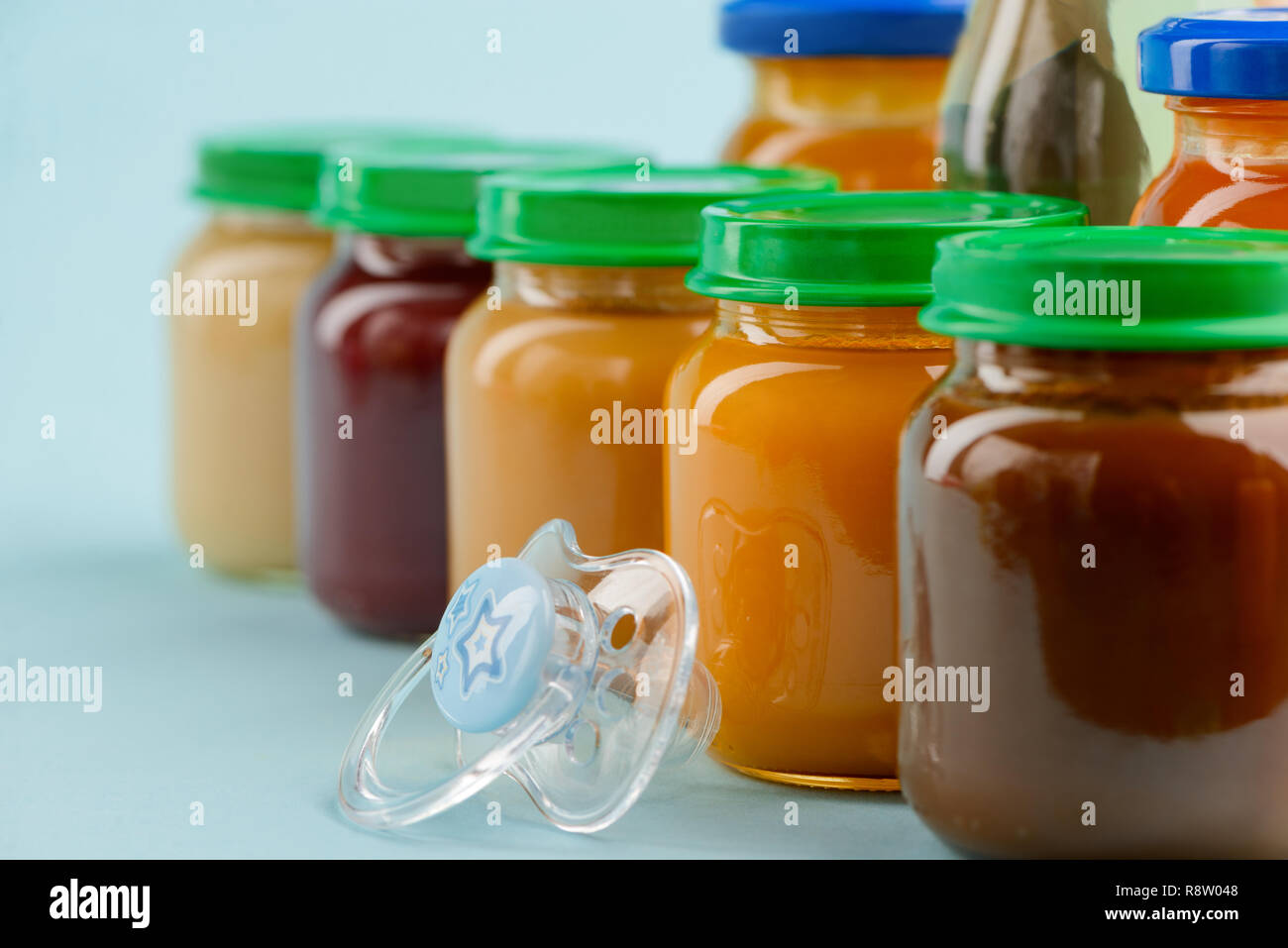Baby food jars and pacifier Stock Photo Alamy