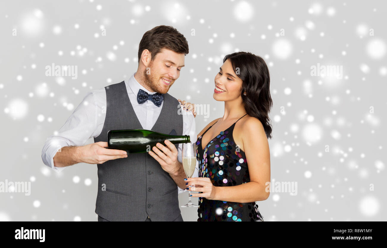 happy couple with champagne celebrating christmas Stock Photo
