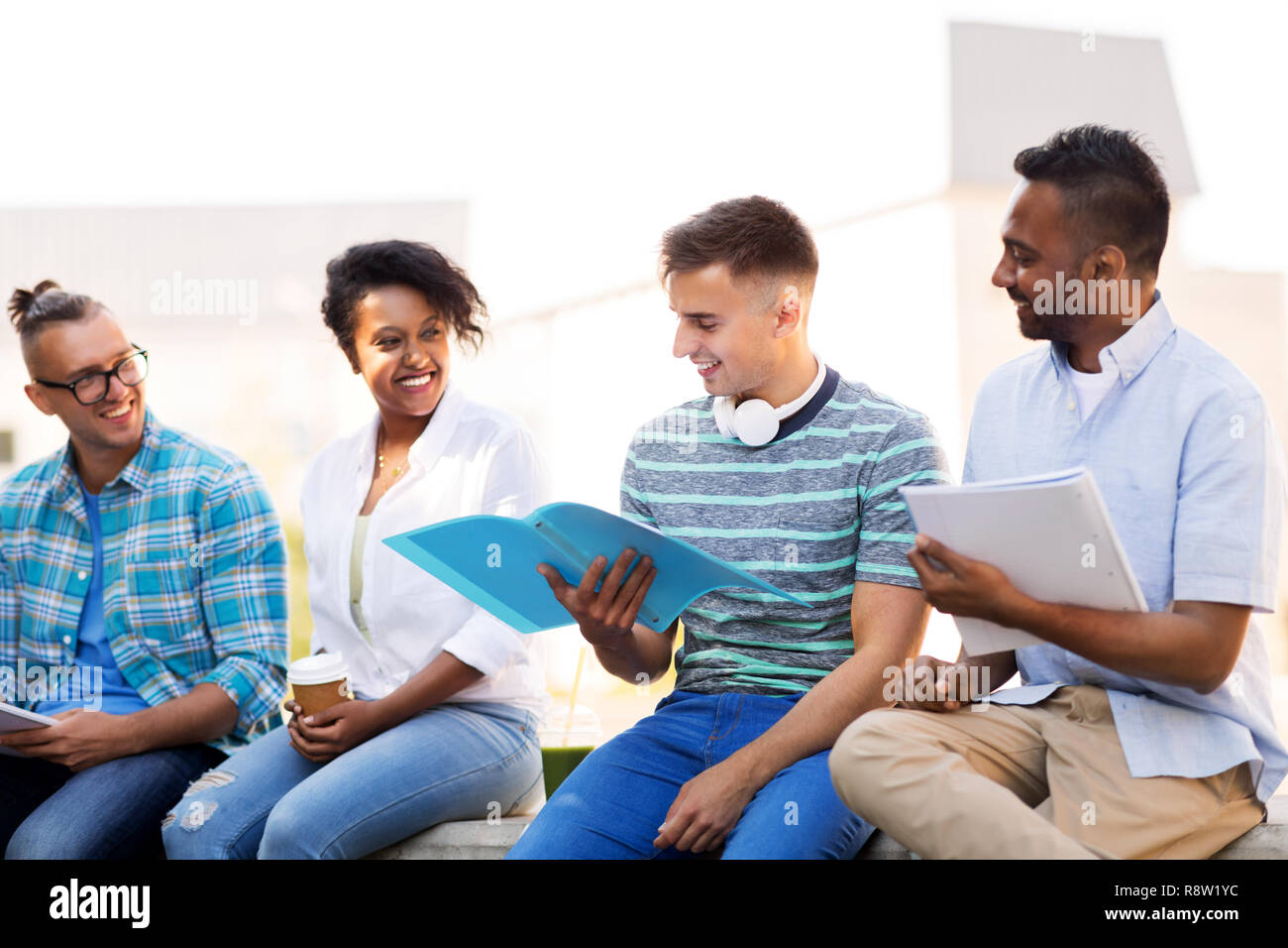 international students with notebooks outdoors Stock Photo