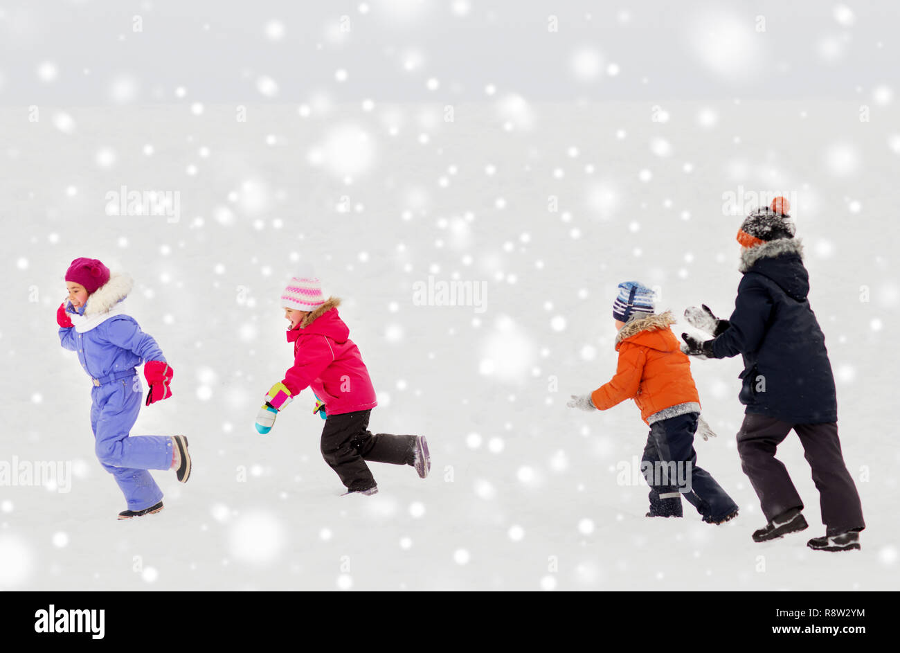 Happy Little Kids Playing Outdoors In Winter Stock Photo Alamy