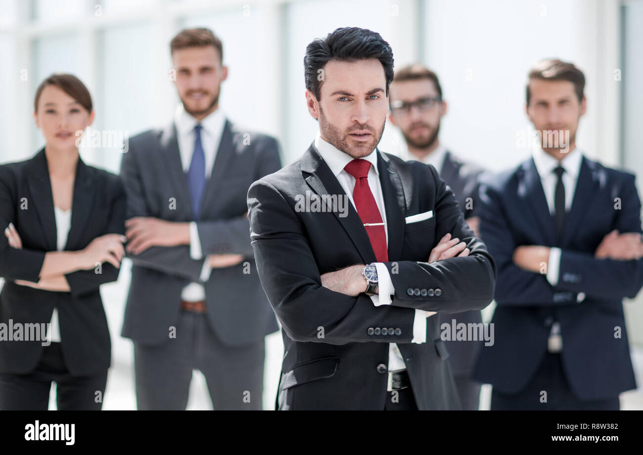 confident businessman in front of his business team Stock Photo - Alamy