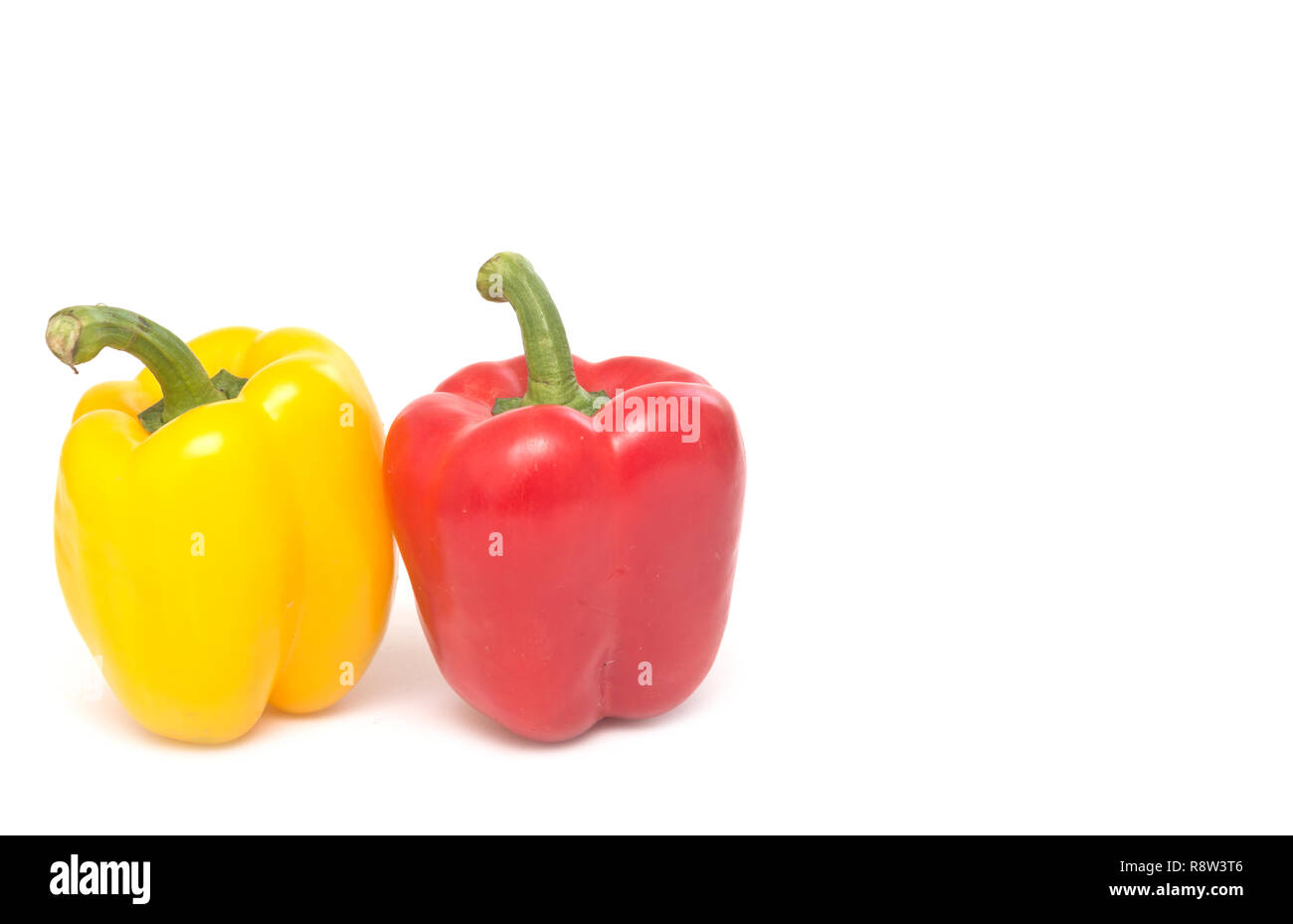 Red and yellow peppers isolated on white background Stock Photo - Alamy