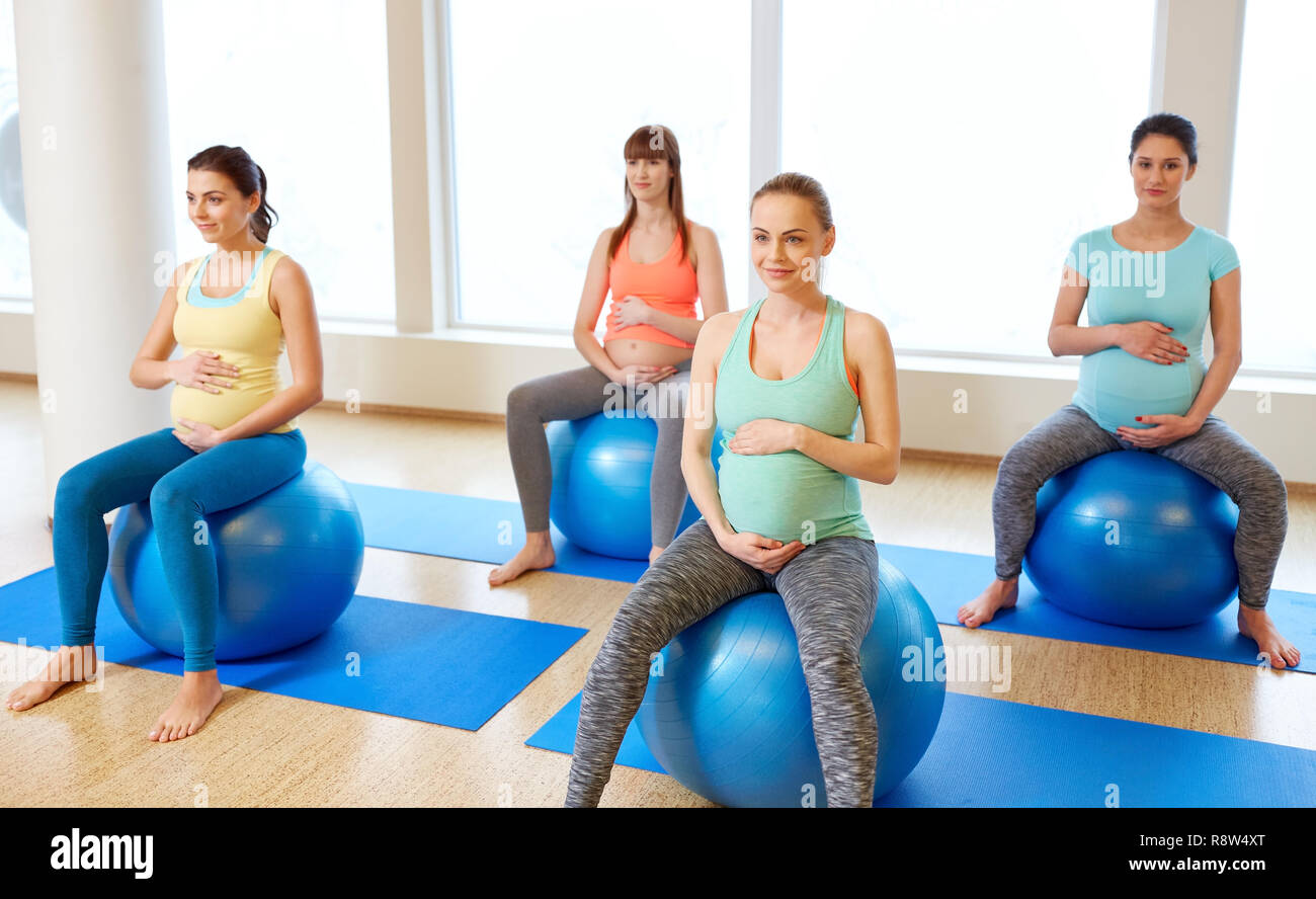 pregnant women sitting on exercise balls in gym Stock Photo Alamy
