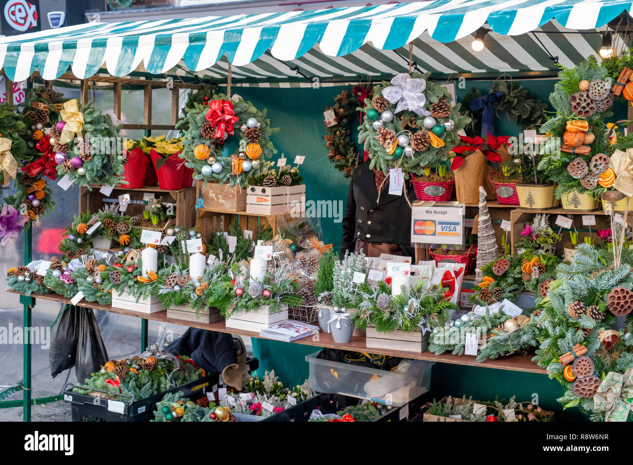 Christmas wreath decorations on a stall at a victorian christmas market. Stratford Upon Avon Christmas wreath decorations on a stall at a victorian christmas market. Stratford Upon Avon