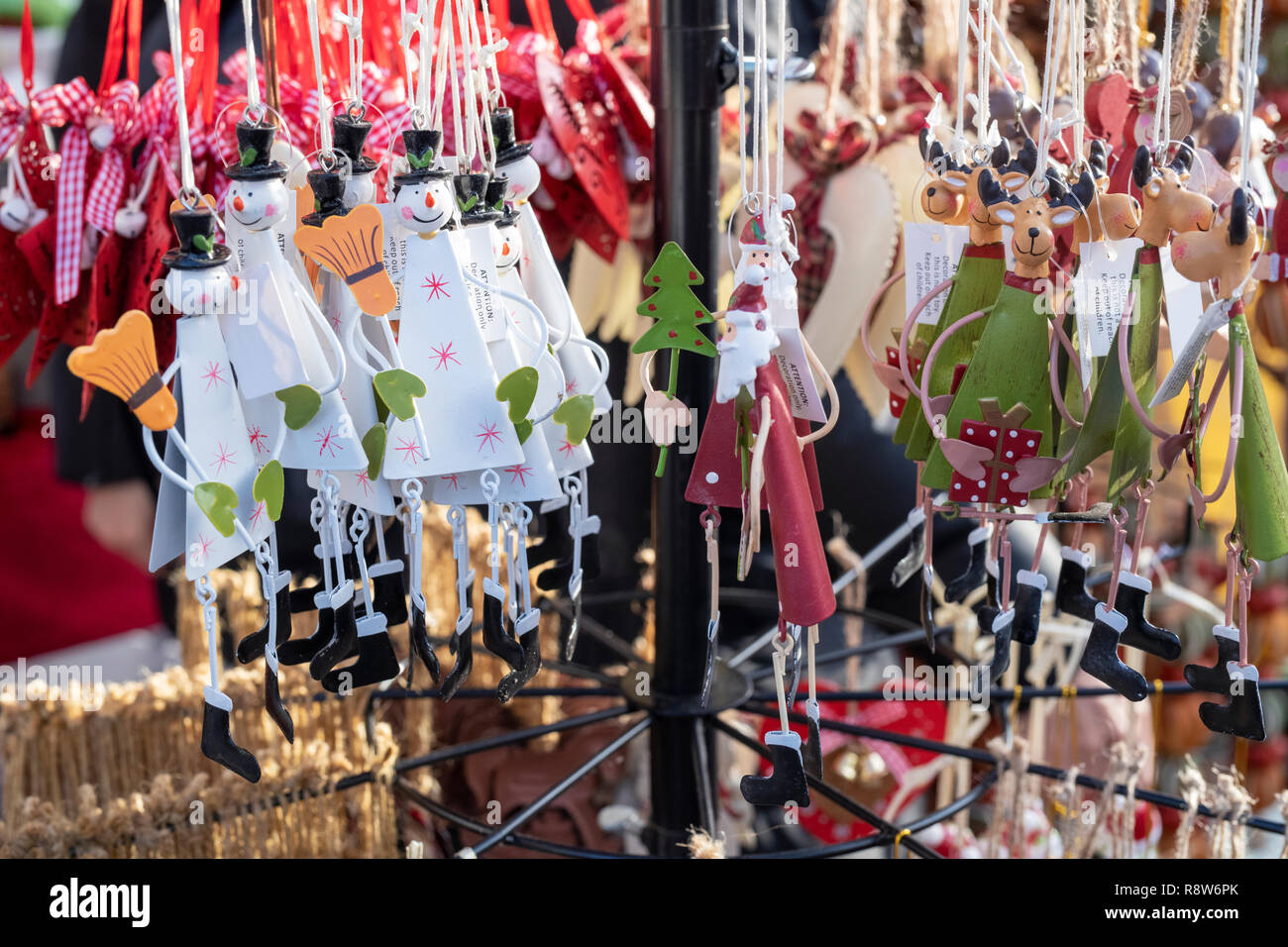 Hanging christmas decorations on a stall at a victorian christmas market. Stratford Upon Avon, Warwickshire, England Stock Photo