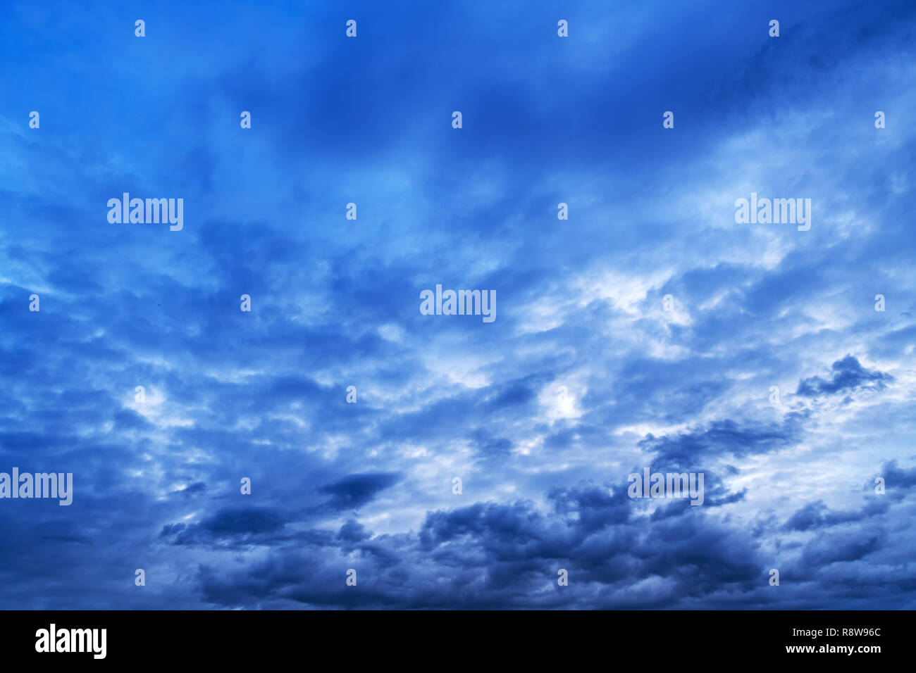 Dramatic winter sky with clouds as seasonal weather background Stock Photo