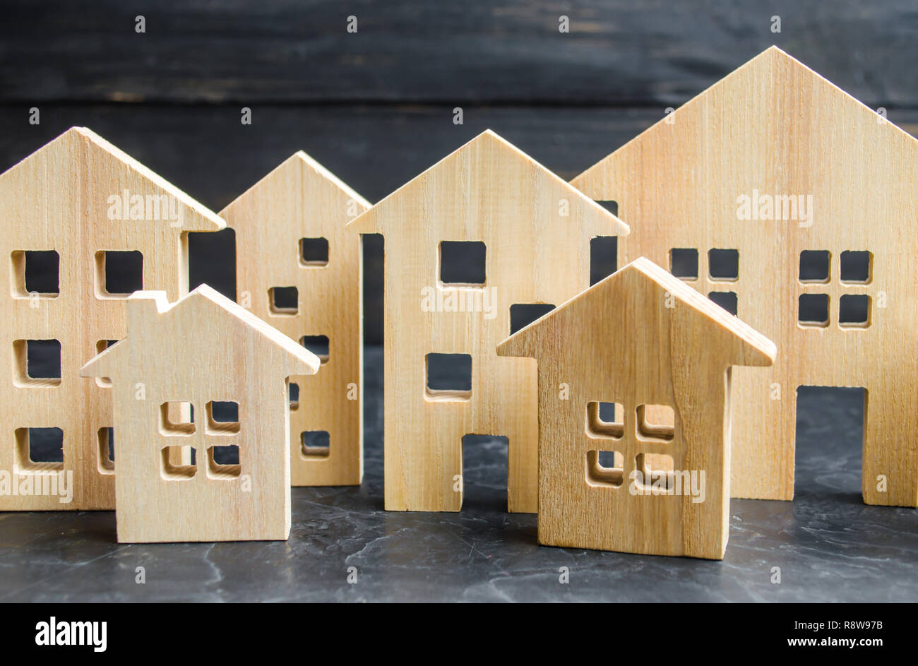Wooden city and houses. concept of rising prices for housing or rent. Growing demand for housing and real estate. The growth of the city and its popul Stock Photo