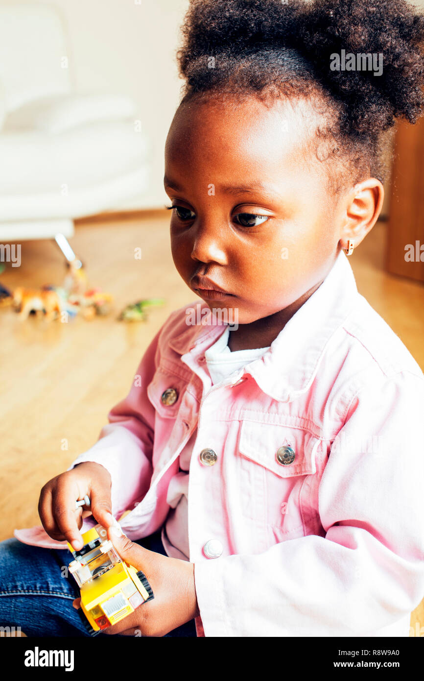 Little Cute African American Girl Playing With Animal Toys At Ho