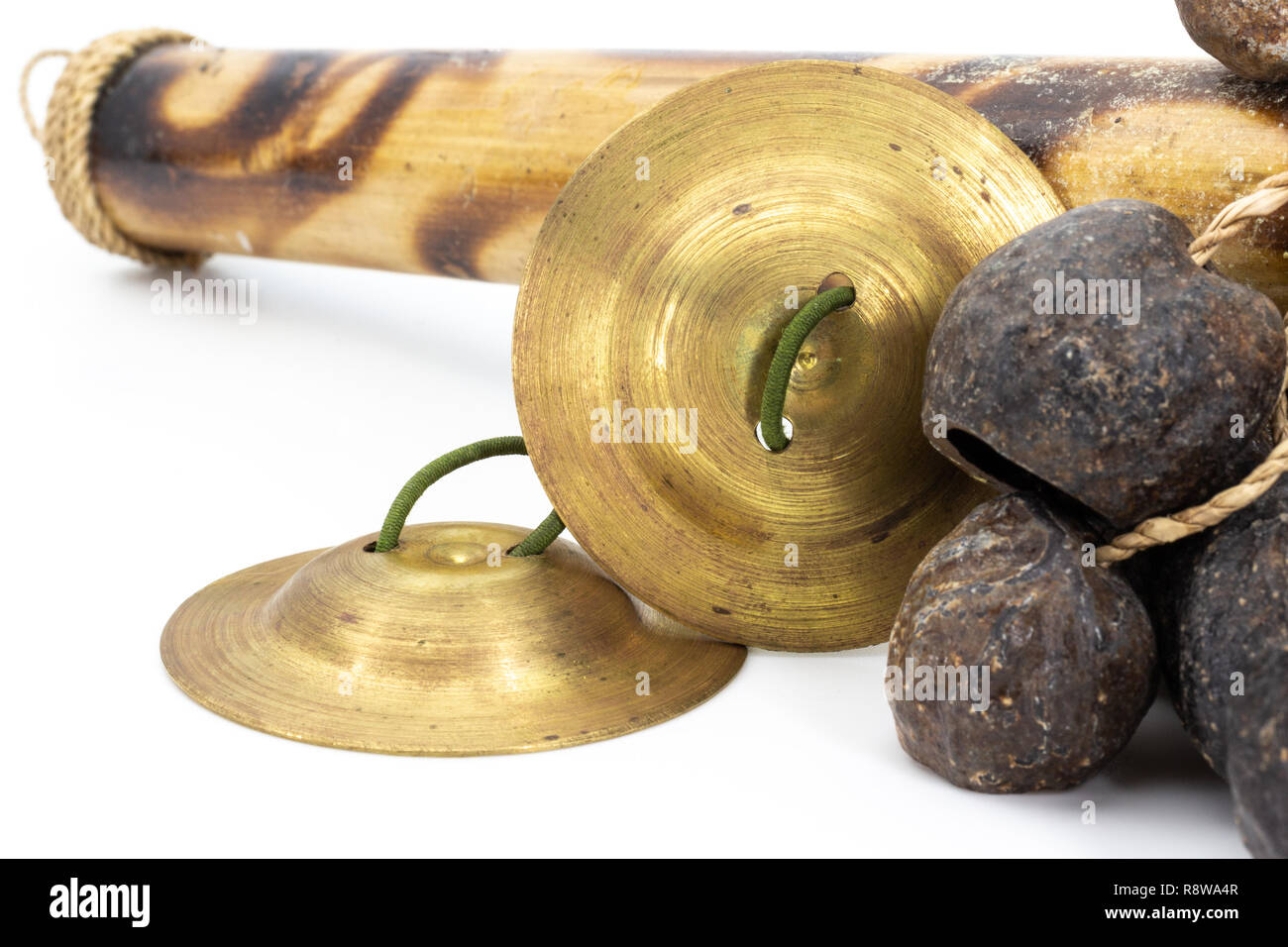 Indian finger cymbals with green rubber handle, studio photo Stock
