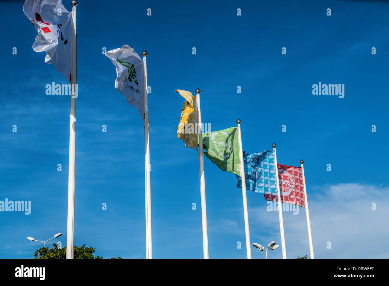 Flags of different countries on a background of blue sky Stock Photo