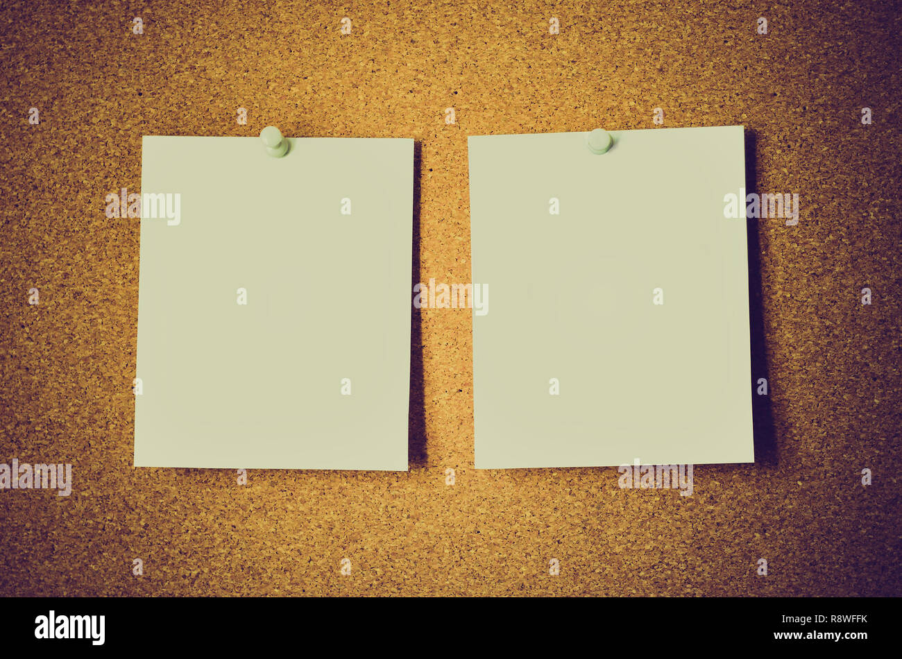 blank note papers on a cork board Stock Photo
