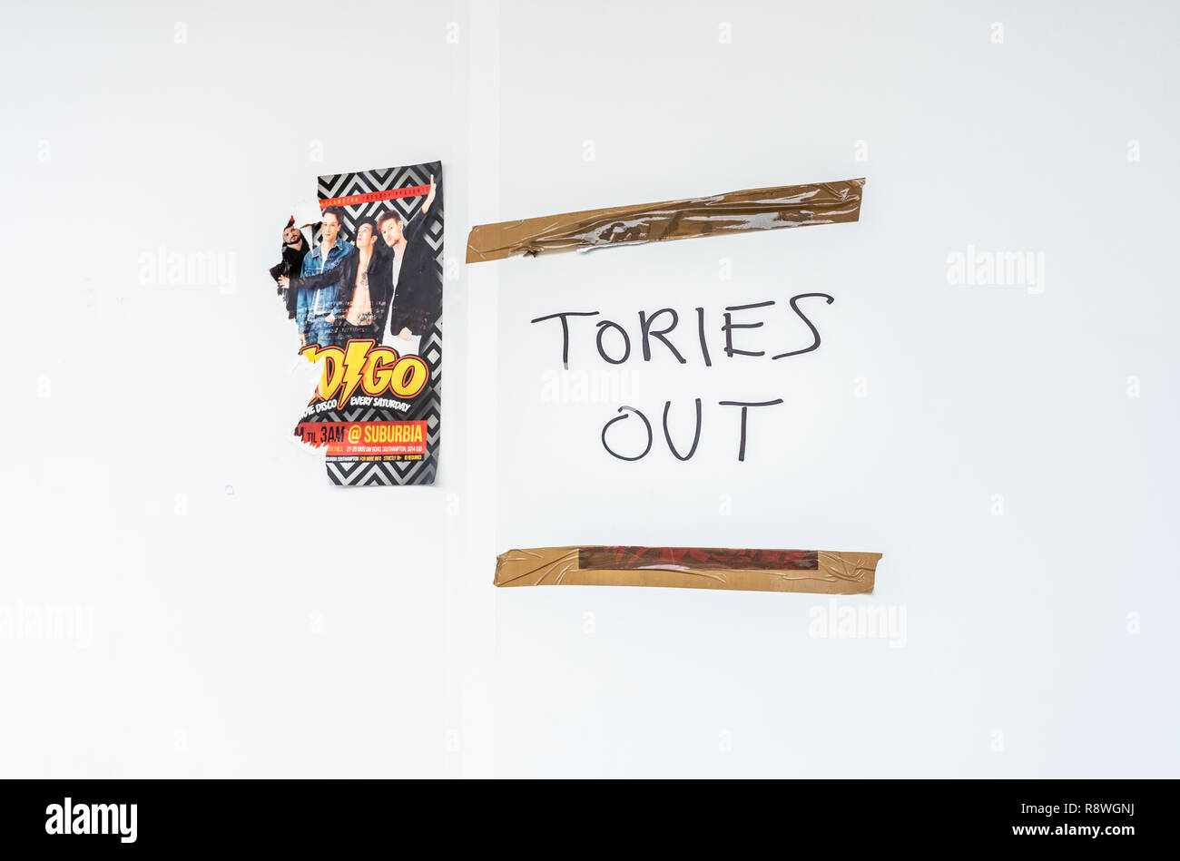 'Tories out' graffiti / political slogan on a white wall in England, UK Stock Photo