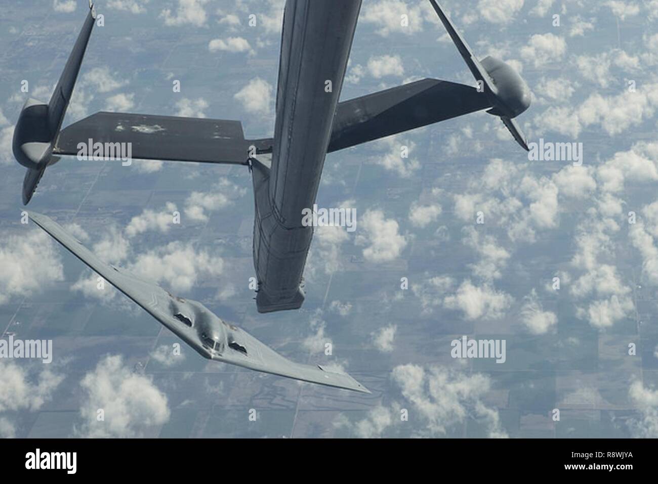 A B-2 Spirit from Whiteman Air Force Base, Mo. backs away and banks left after receiving fuel from a KC-10 Extender from Joint Base McGuire-Dix-Lakehurst, N.J. during a Mobility Exercise held by JB MDL. The Joint Base holds an annual MOBEX in Gulfport, Miss. to practice deploying and operating in a deployed environment. Stock Photo
