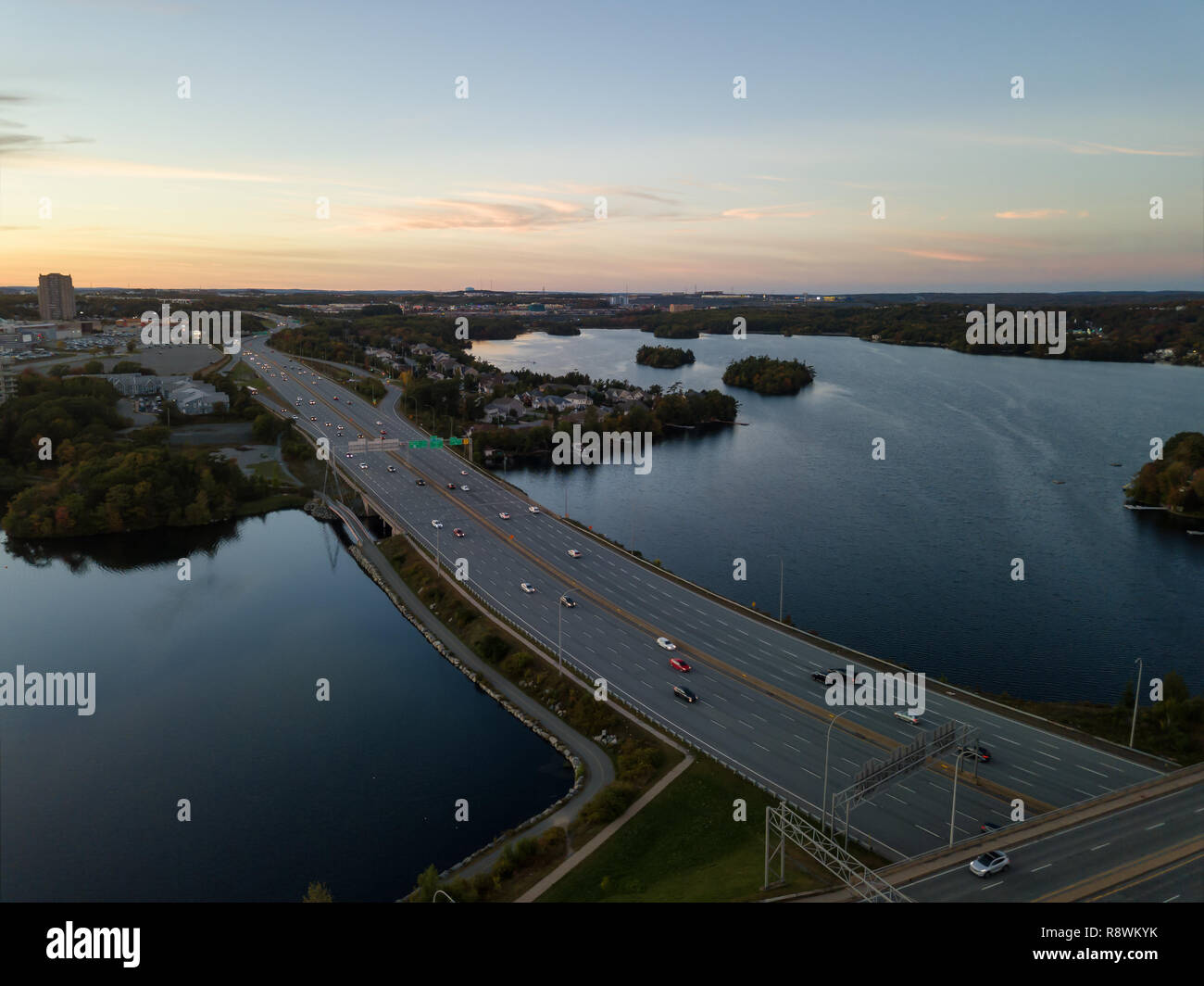 Aerial view of a Highway in the Modern City during a vibrant Sunset