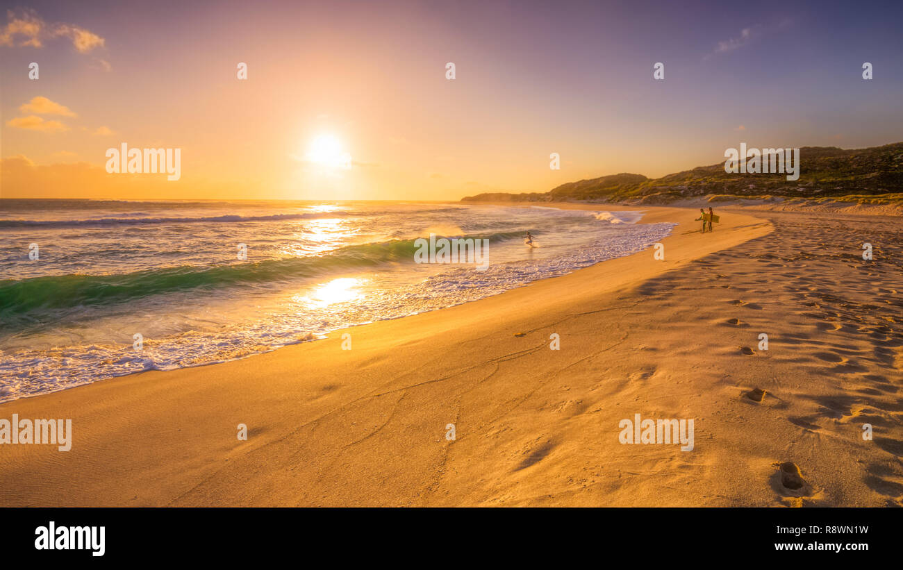 Sunset Surfers Stock Photo