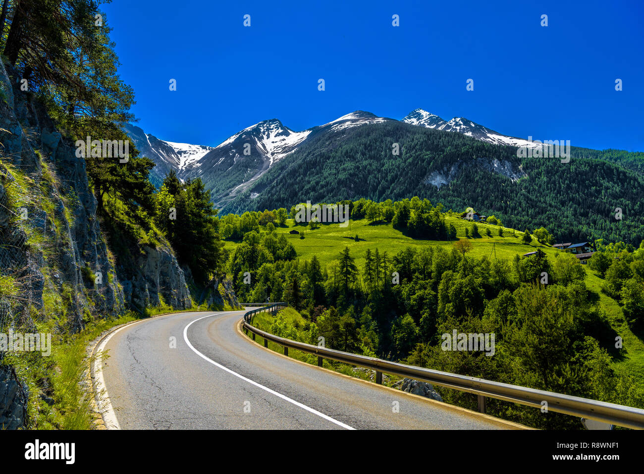 Asphalt road in Alps mountains in Moerel, Filet, Oestlich Raron, Wallis Valais Switzerland Stock Photo