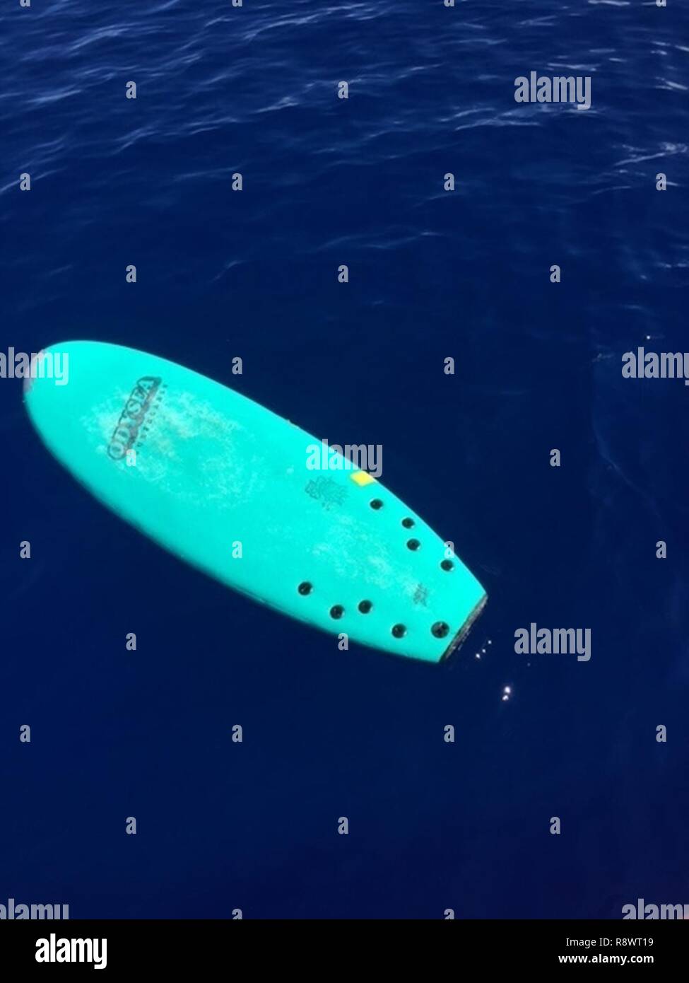 The Coast Guard is seeking the public’s help identifying the owner of an adrift, ODYSEA surfboard found approximately 2 miles off of Waikiki, Oahu, Thursday, Mar 16, 2017. Stock Photo
