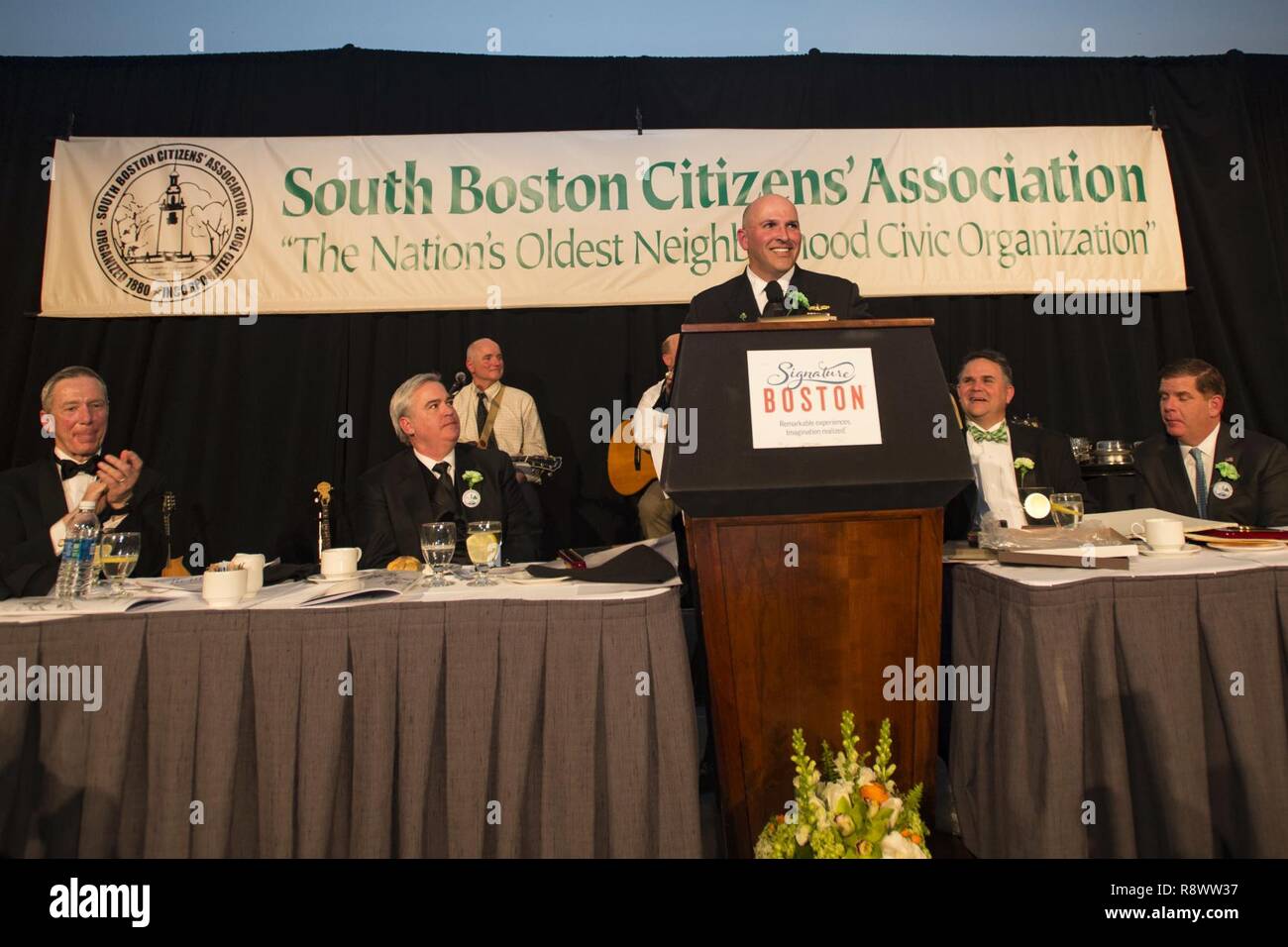 BOSTON (March 17, 2017) The guide-missile cruiser USS San Jacinto (CG 56) Commanding Officer Capt. Dennis Valuez gives a speech at the South Boston Citizen’s Association Evacuation Day Banquet. USS San Jacinto (CG 56) participates in Boston's, St. Patrick’s Day festivities and community programs throughout the city. Stock Photo