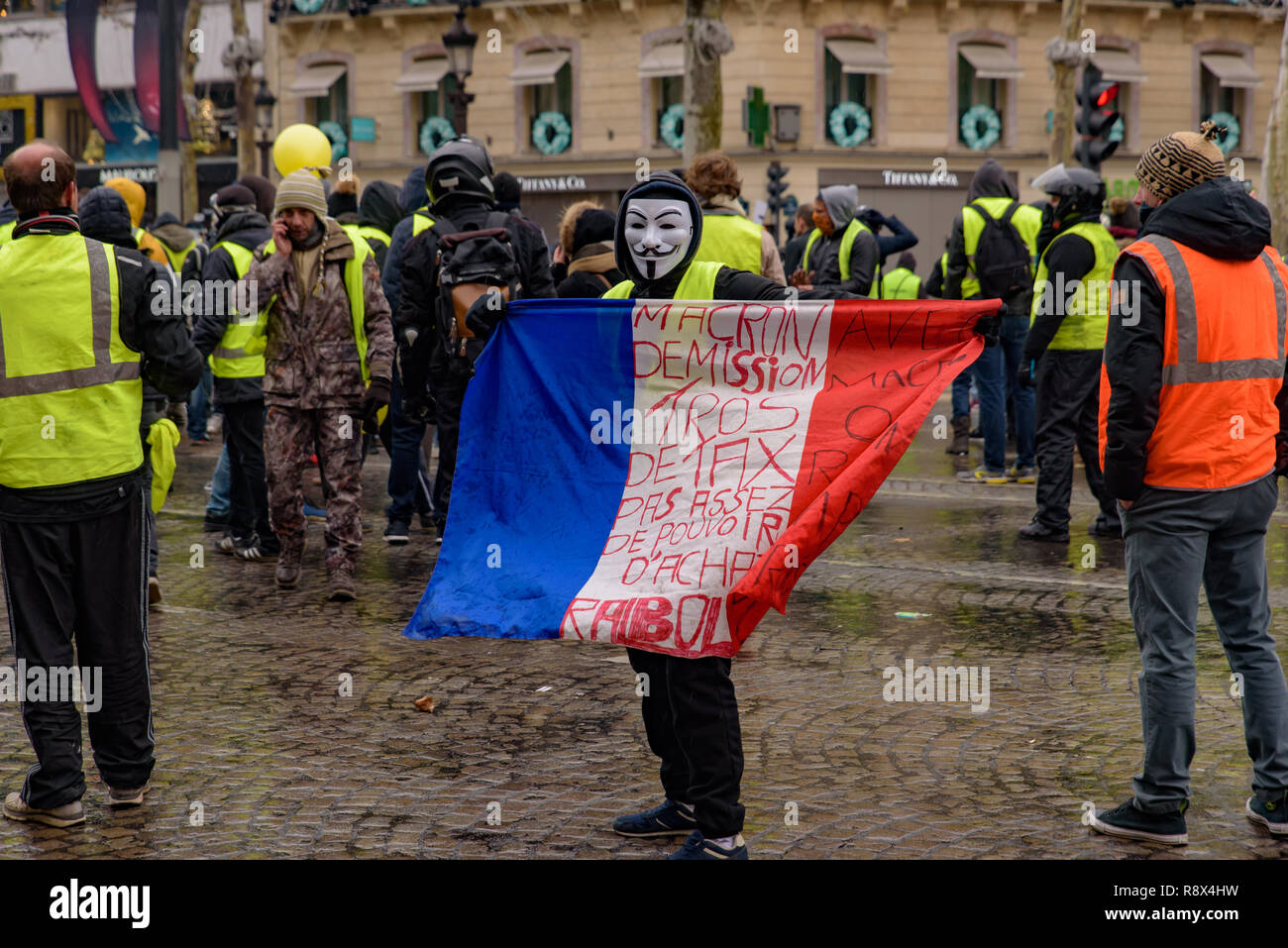 5th Yellow Vests demonstration (Gilets Jaunes) protesters against fuel tax,  government, and French President Macron with slogan at Champs-Élysées Stock  Photo - Alamy