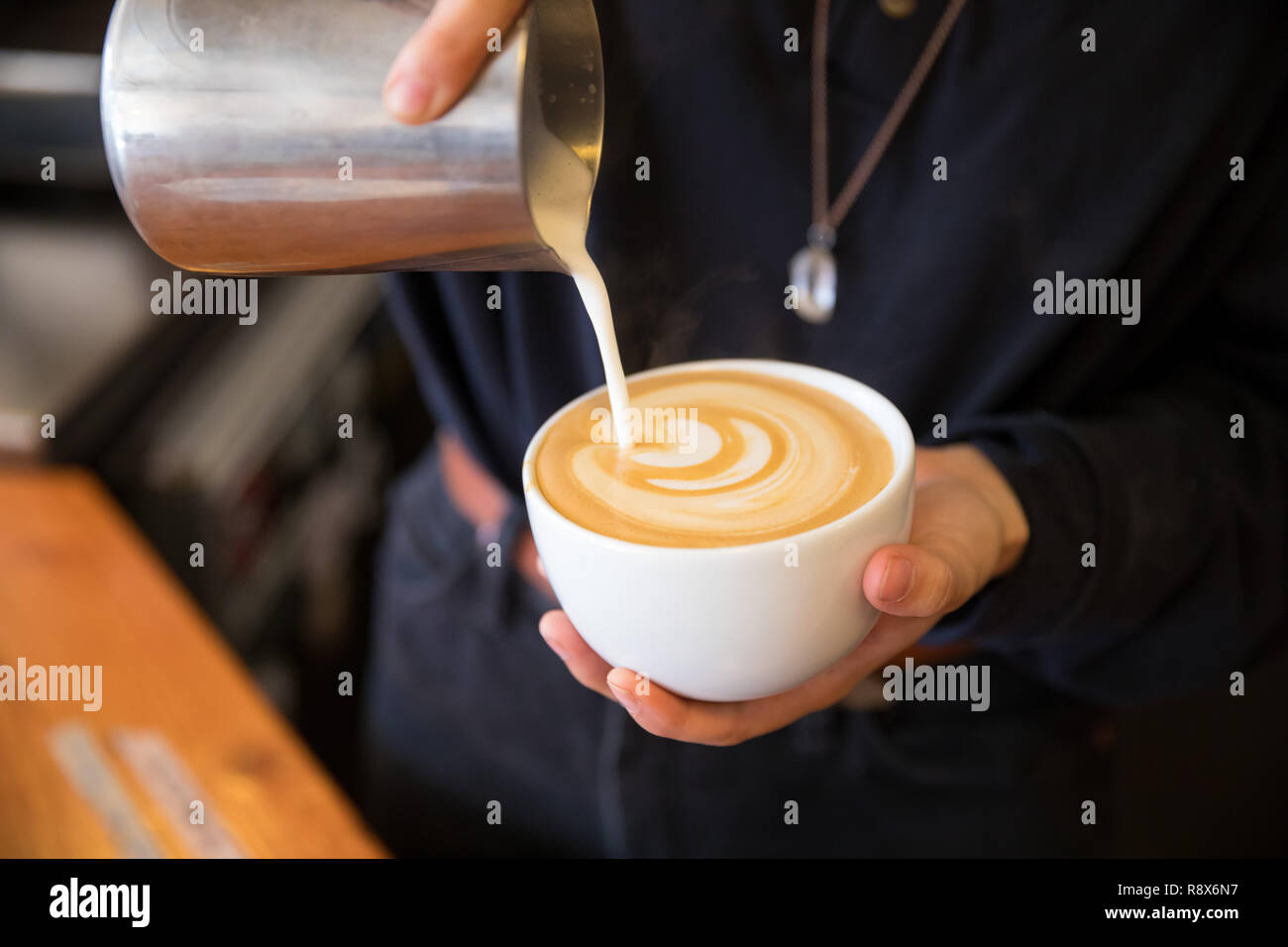 Barista Pouring Espresso Drink Latte at Coffee Shop Stock Photo