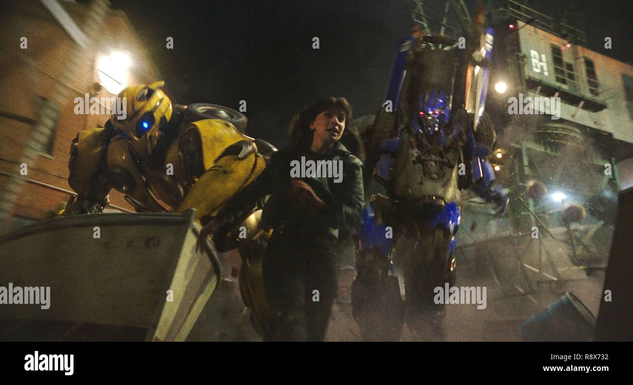 BUMBLEBEE, from left Bumblebee (voice Dylan O'Brien), Hailee