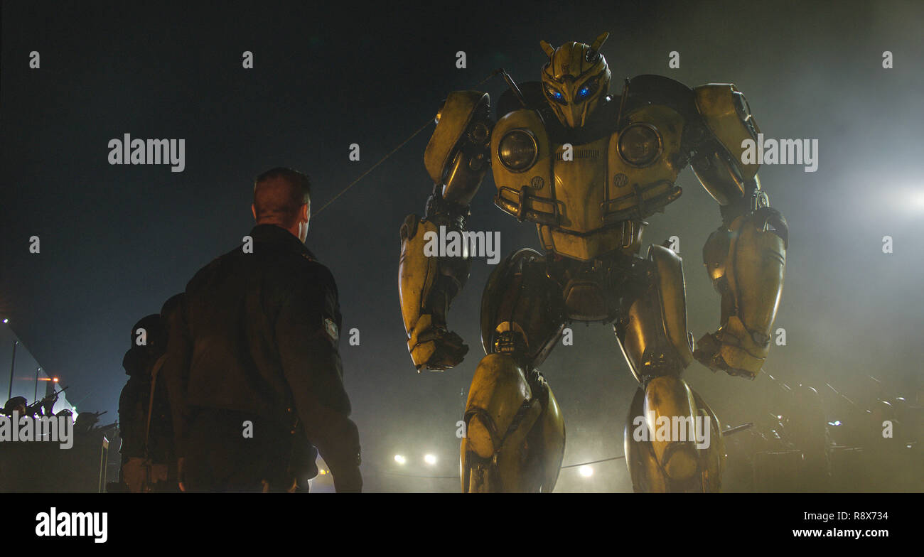 BUMBLEBEE, from left John Cena (back turned), Bumblebee (voice Dylan