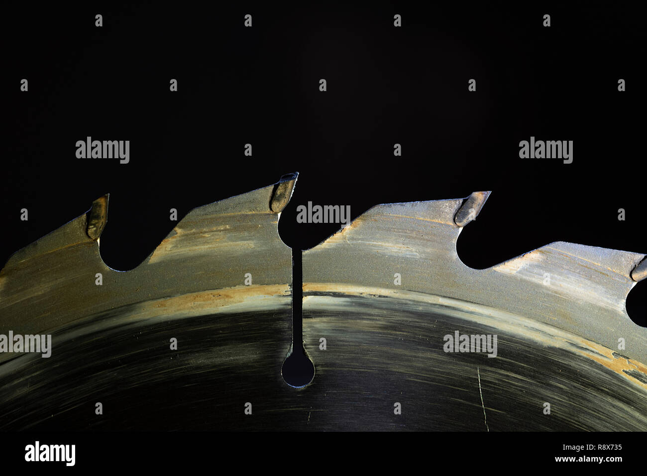 Circular Saw Blade with Tungsten Carbide Teeth, Close-up, Side View, Low Key Stock Photo