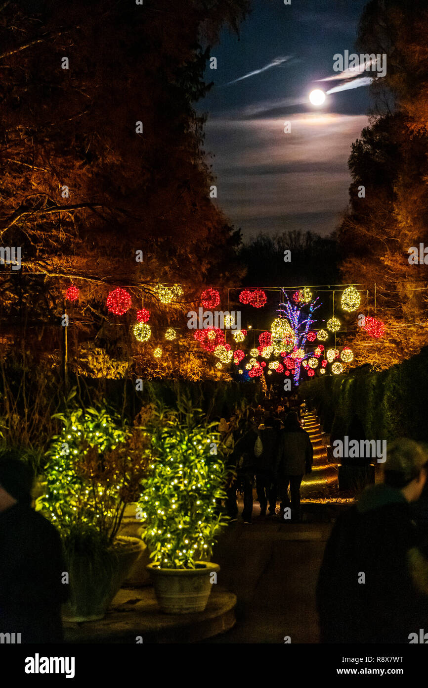 Full moon rising over Christmas lights & decorations; Longwood Gardens; Kennett Square; Pennsylvania; USA Stock Photo